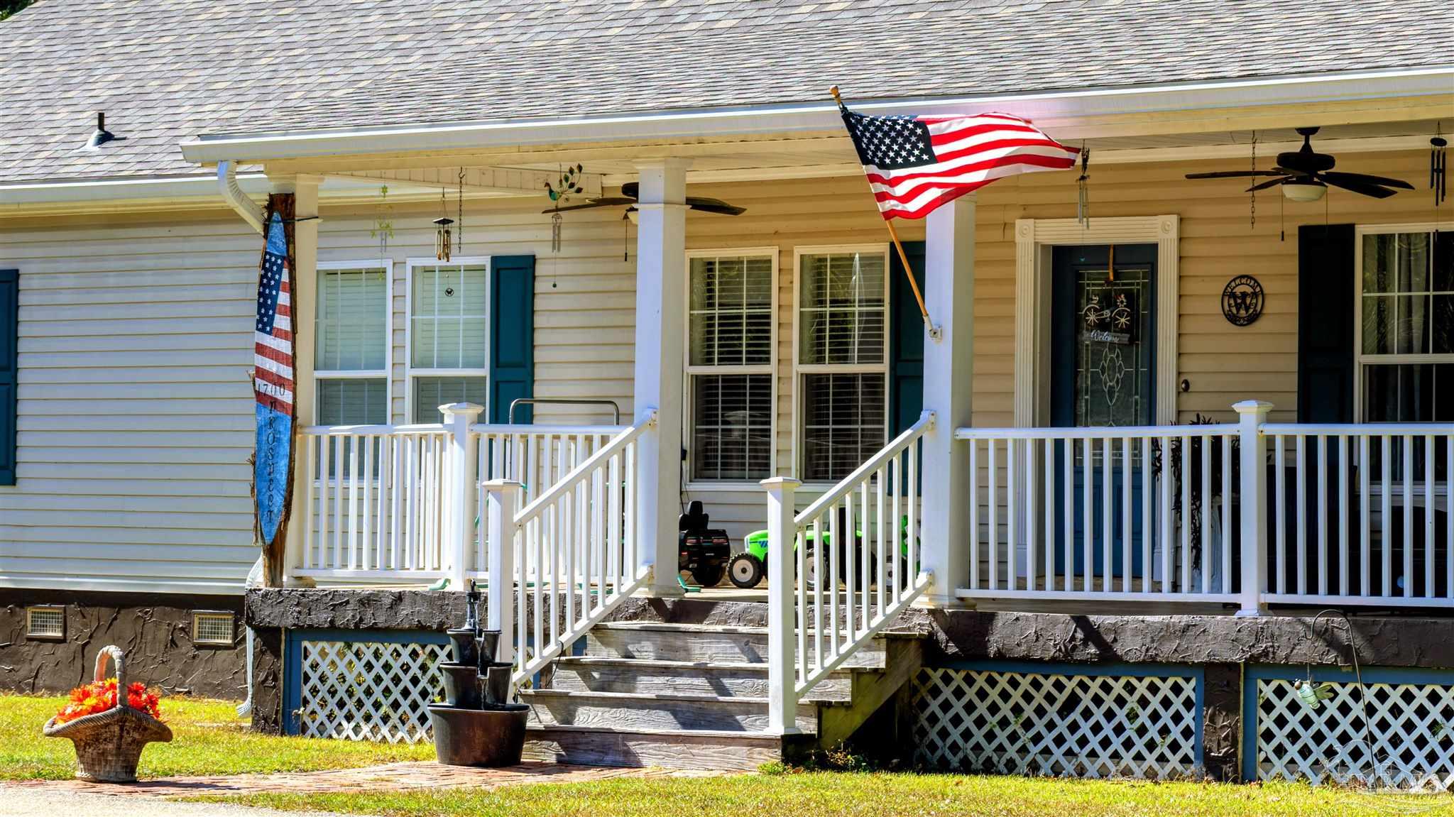 1700 Prospect Road Coffeeville, AL 36524 - Photo 2 of 71 a view of a house with a small yard and wooden fence