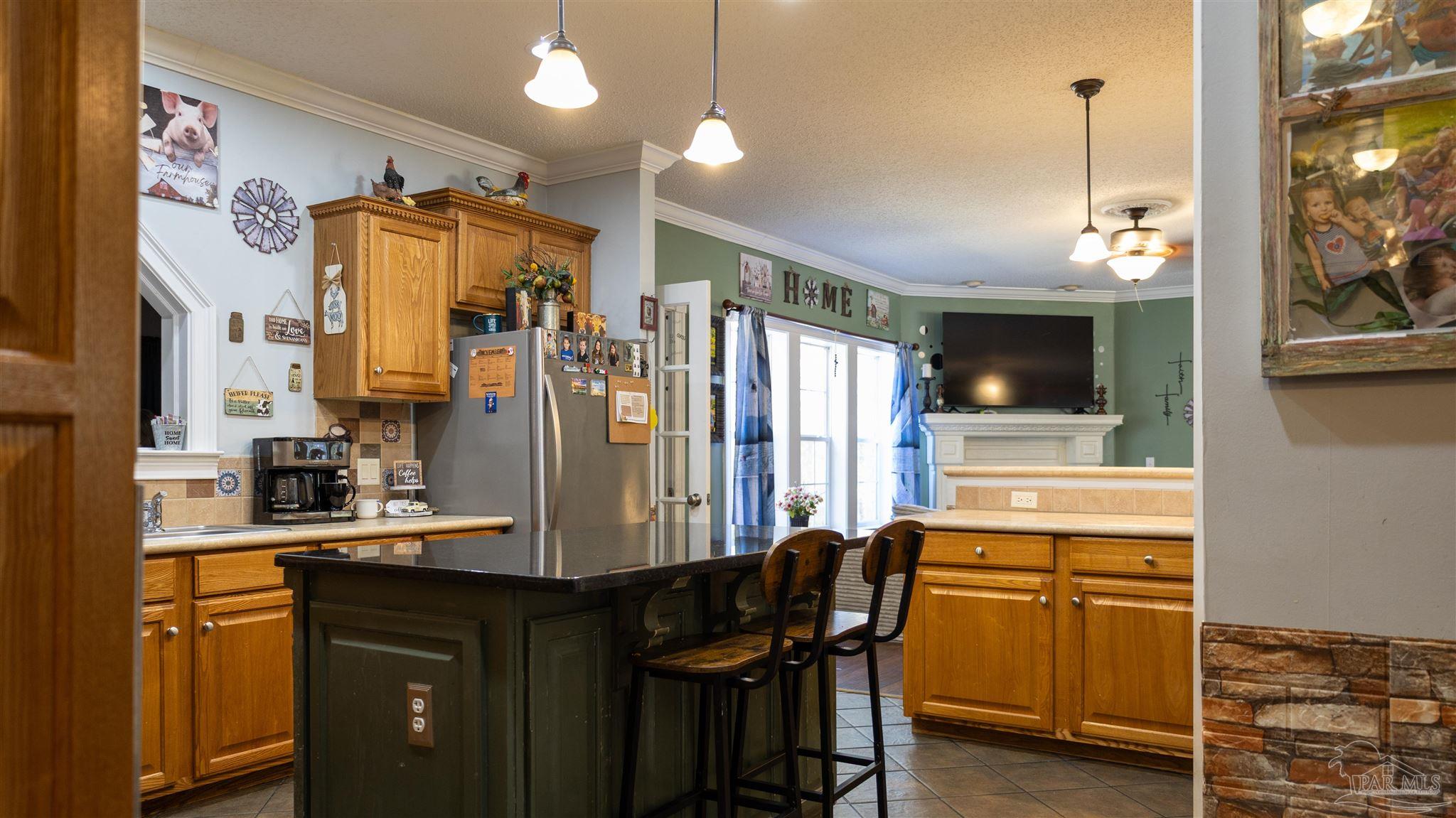 1700 Prospect Road Coffeeville, AL 36524 - Photo 24 of 71 a kitchen with refrigerator cabinets and furniture