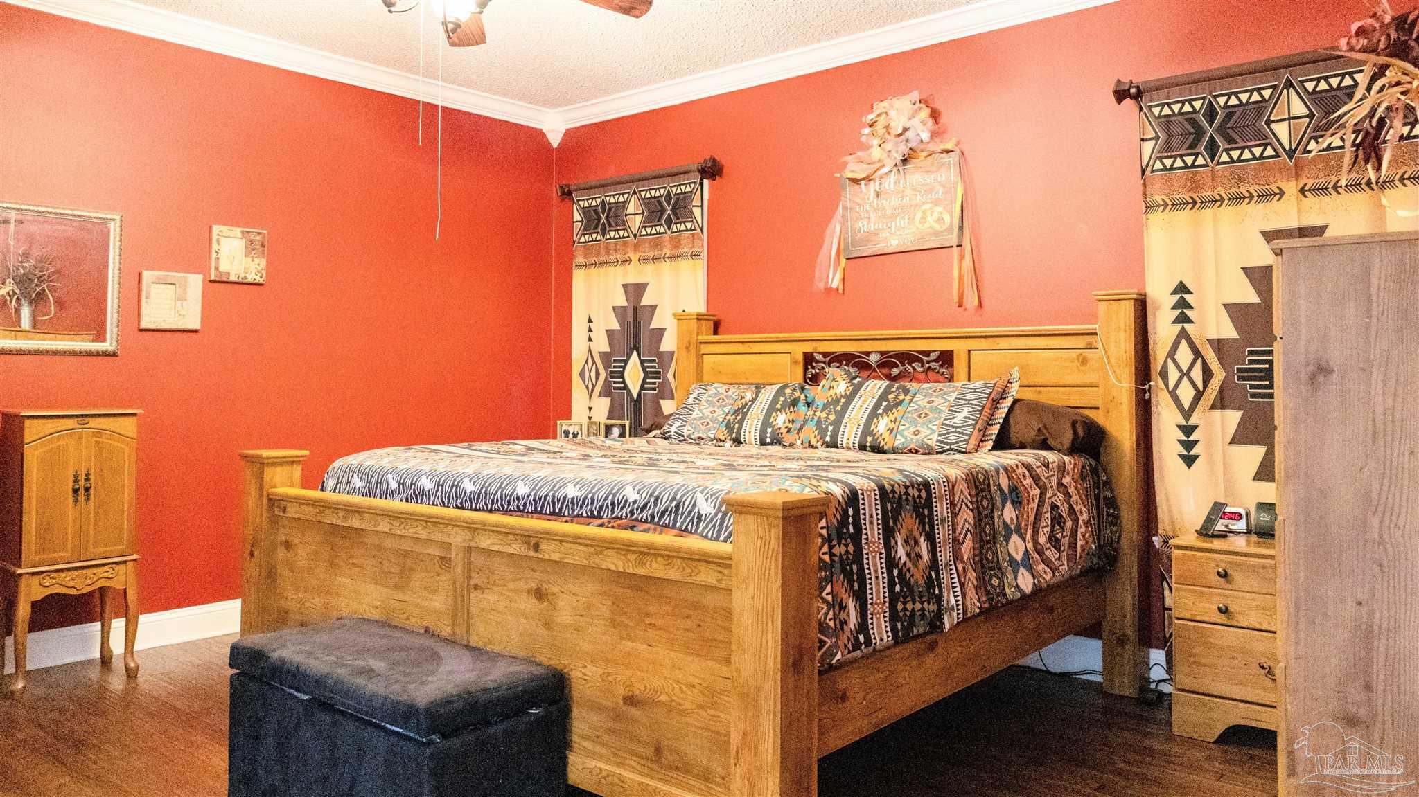 1700 Prospect Road Coffeeville, AL 36524 - Photo 31 of 71 a bedroom with a bed and wooden floor