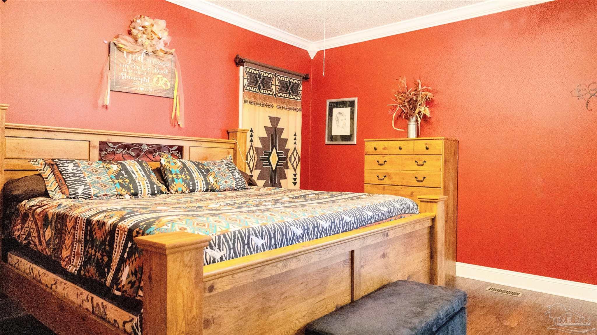 1700 Prospect Road Coffeeville, AL 36524 - Photo 32 of 71 a bedroom with a bed and wooden floor