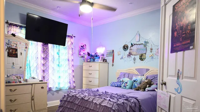 a bathroom with a sink a toilet and shower curtain