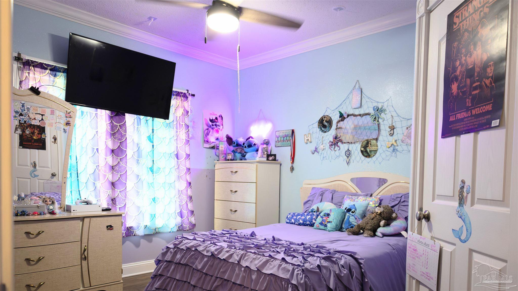 1700 Prospect Road Coffeeville, AL 36524 - Photo 33 of 71 a bedroom with a bed and a flat screen tv