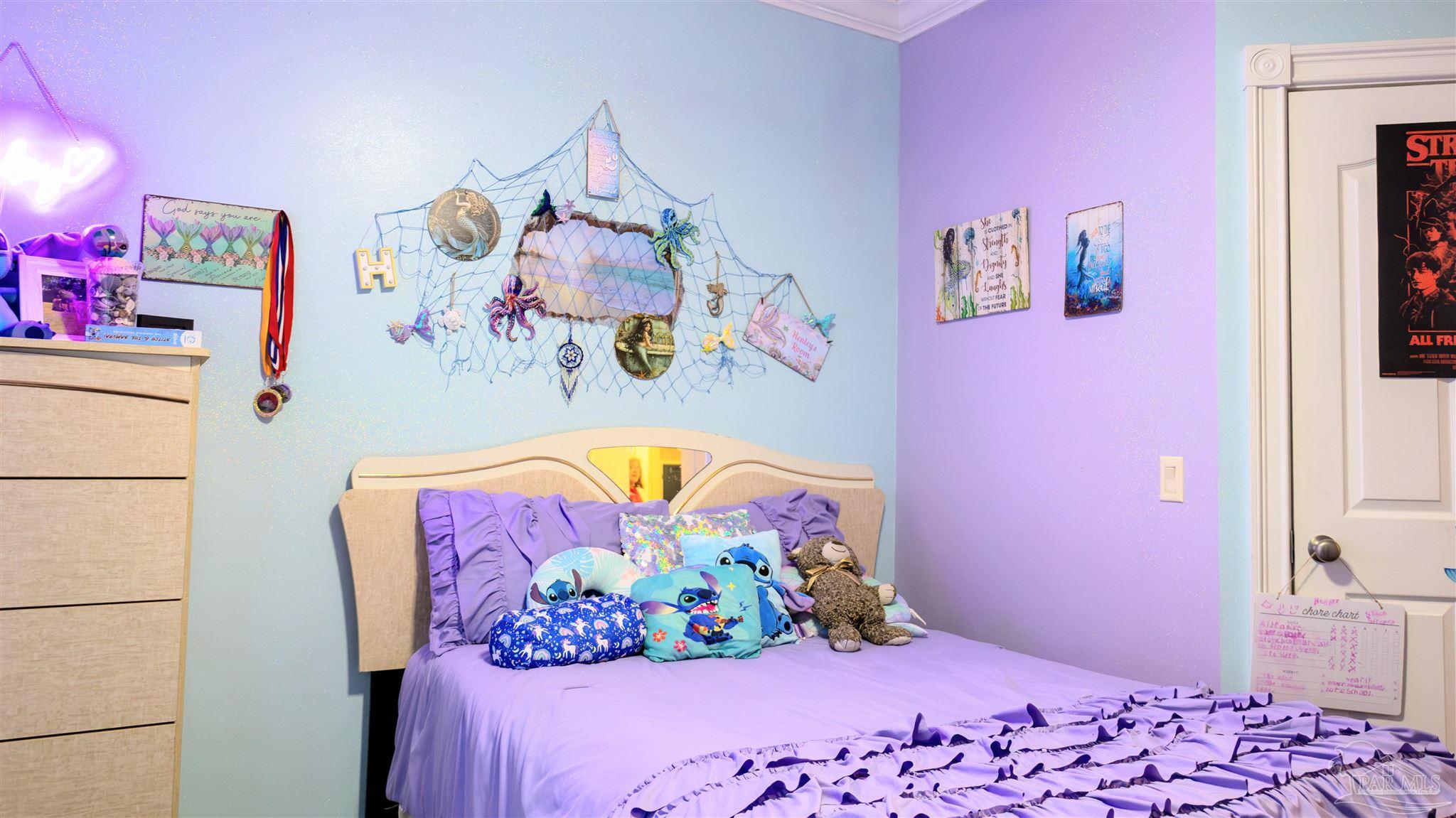 1700 Prospect Road Coffeeville, AL 36524 - Photo 34 of 71 a bedroom with a bed and a wall painting