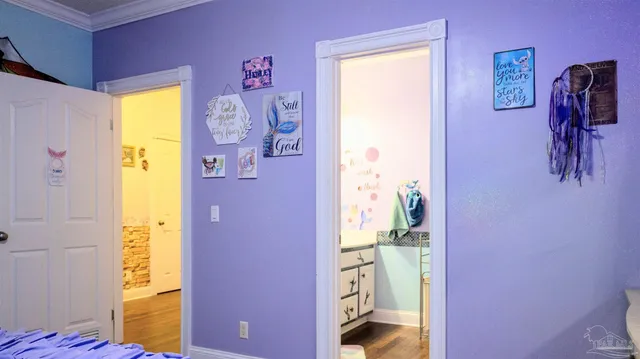 a bathroom with a toilet a sink and a mirror