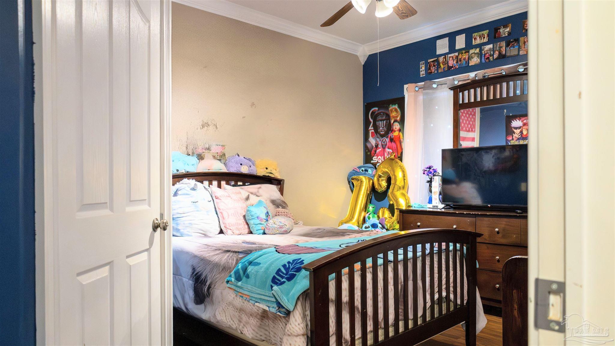 1700 Prospect Road Coffeeville, AL 36524 - Photo 36 of 71 a bedroom with a bed and a tv in it