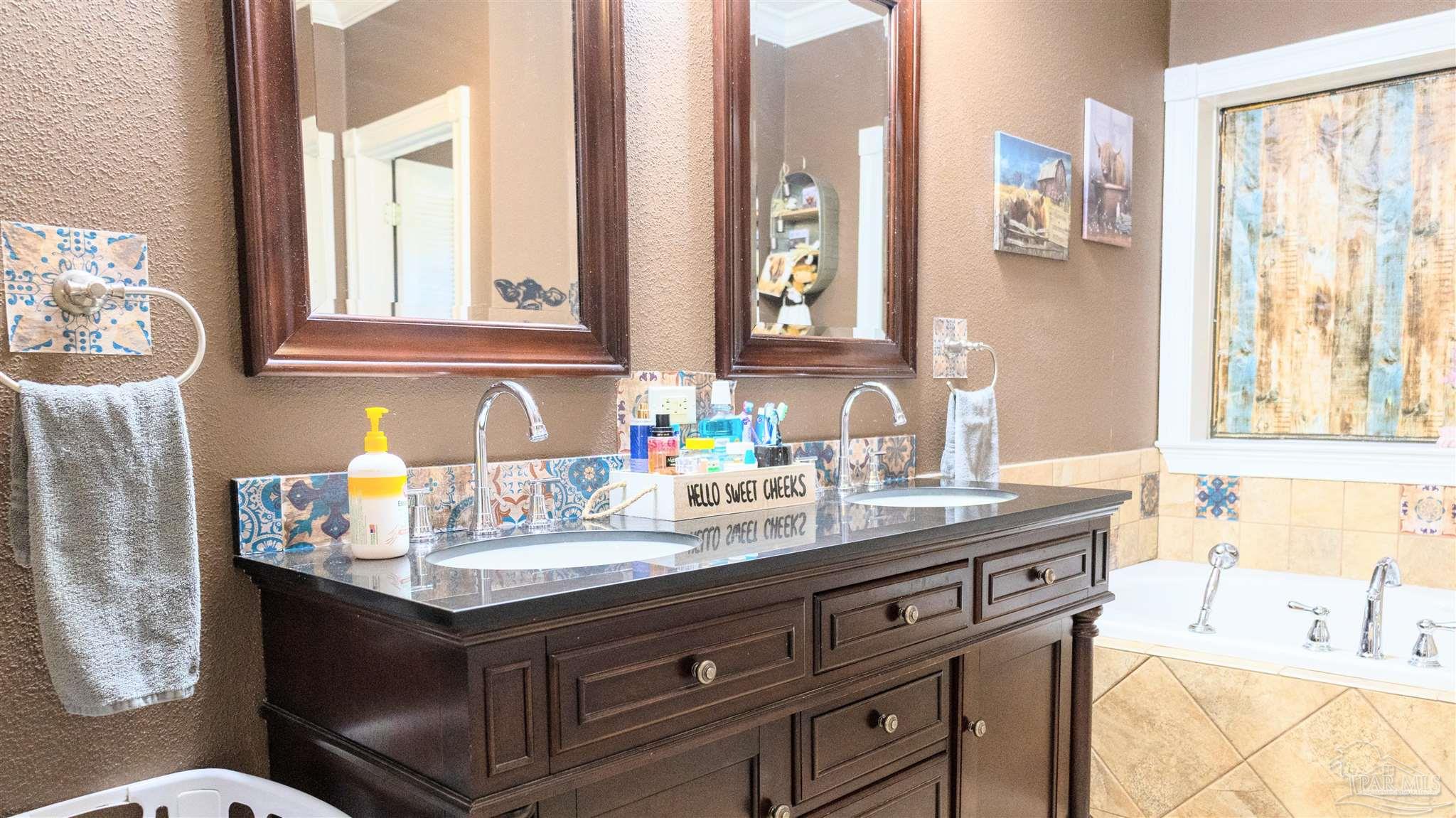1700 Prospect Road Coffeeville, AL 36524 - Photo 41 of 71 a bathroom with a sink and a mirror