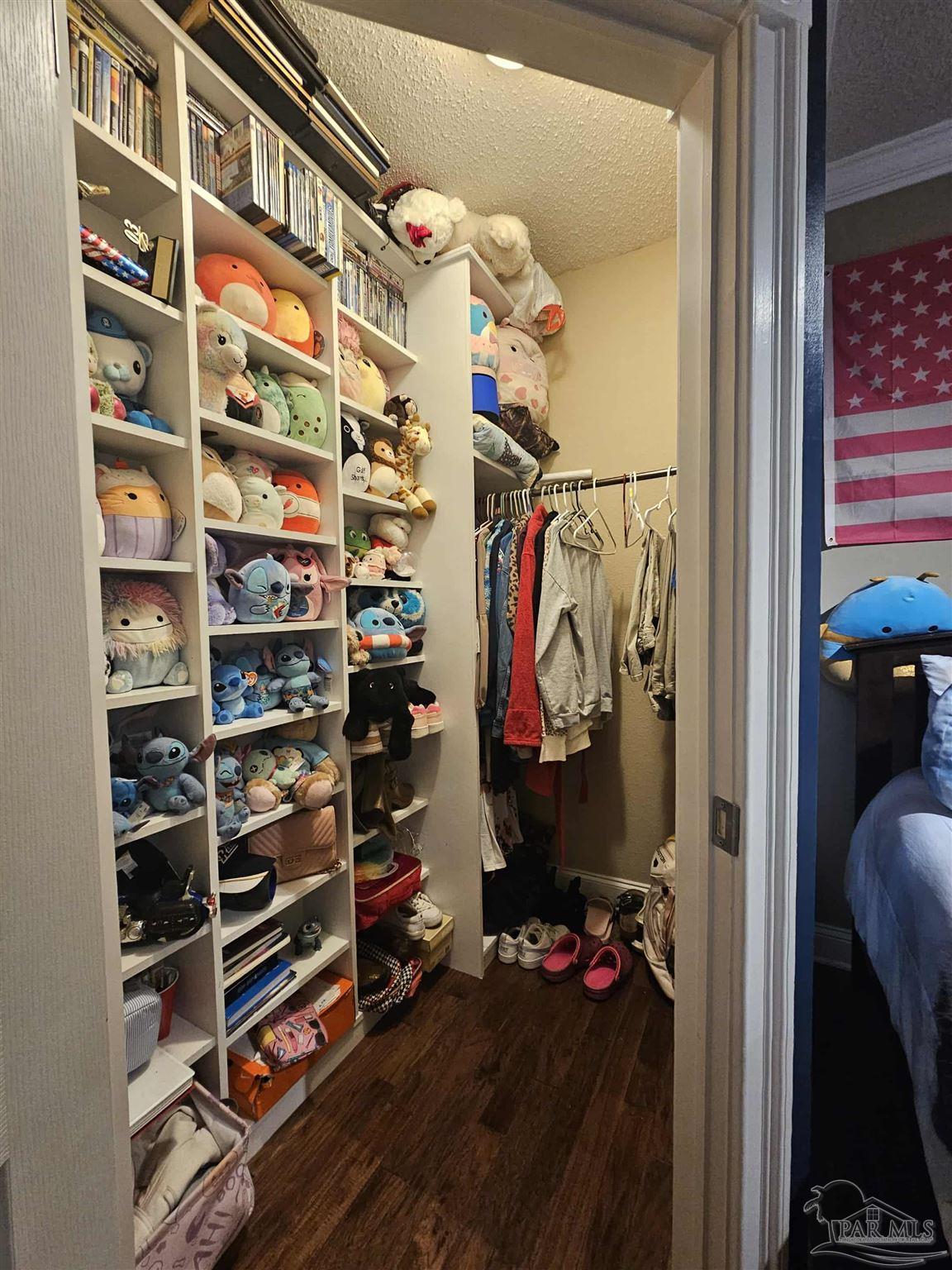 1700 Prospect Road Coffeeville, AL 36524 - Photo 46 of 71 a view of walk in closet with clothes and shoes