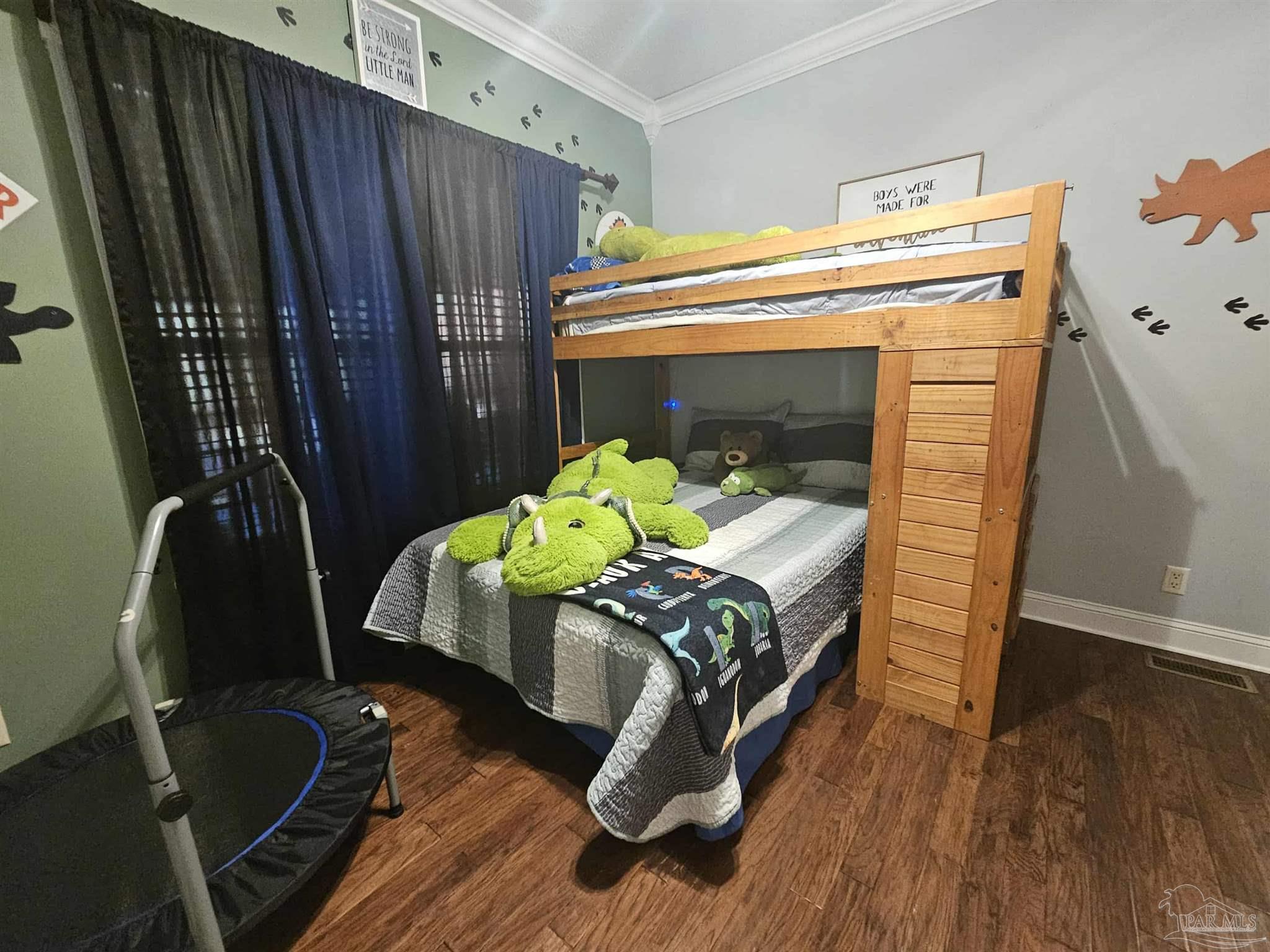 1700 Prospect Road Coffeeville, AL 36524 - Photo 47 of 71 a bedroom with furniture and a wooden floor