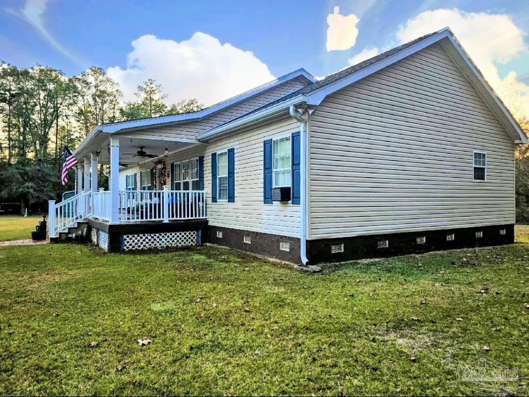 1700 Prospect Road Coffeeville, AL 36524 - Photo 49 of 71 a view of a house with a yard