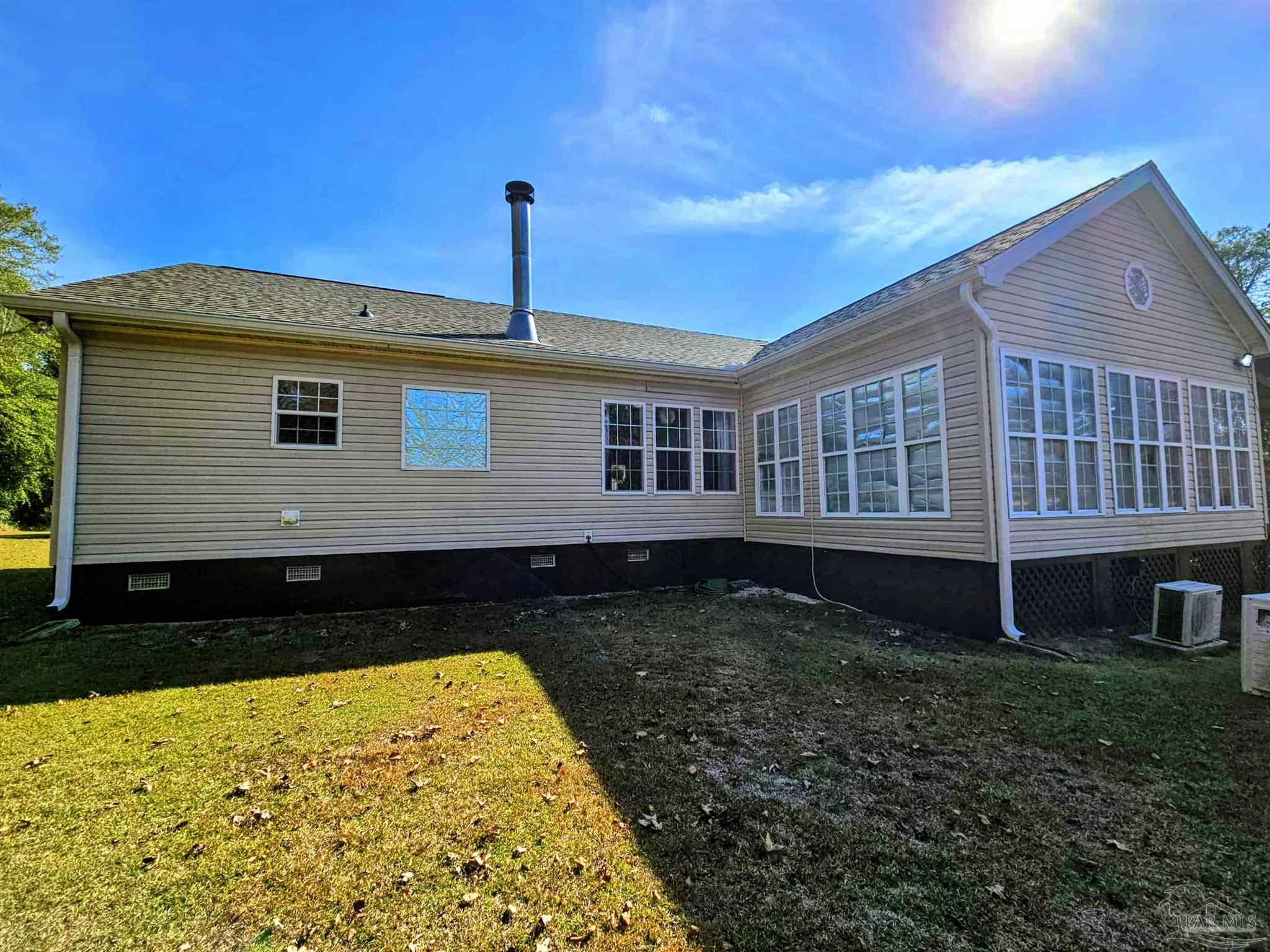 1700 Prospect Road Coffeeville, AL 36524 - Photo 59 of 71 a front view of a house with a garden