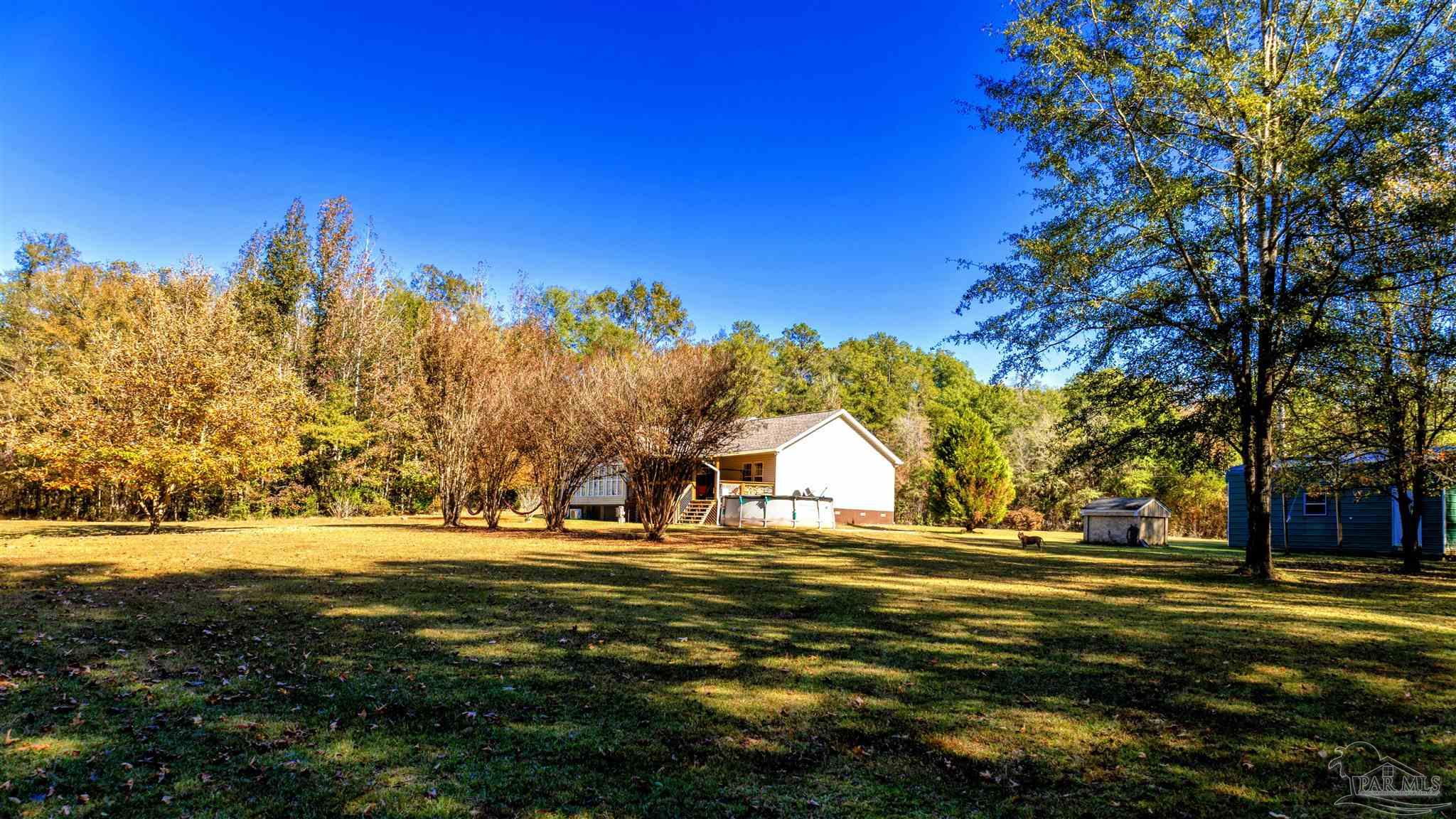 1700 Prospect Road Coffeeville, AL 36524 - Photo 62 of 71 a view of swimming pool with an outdoor space and seating area