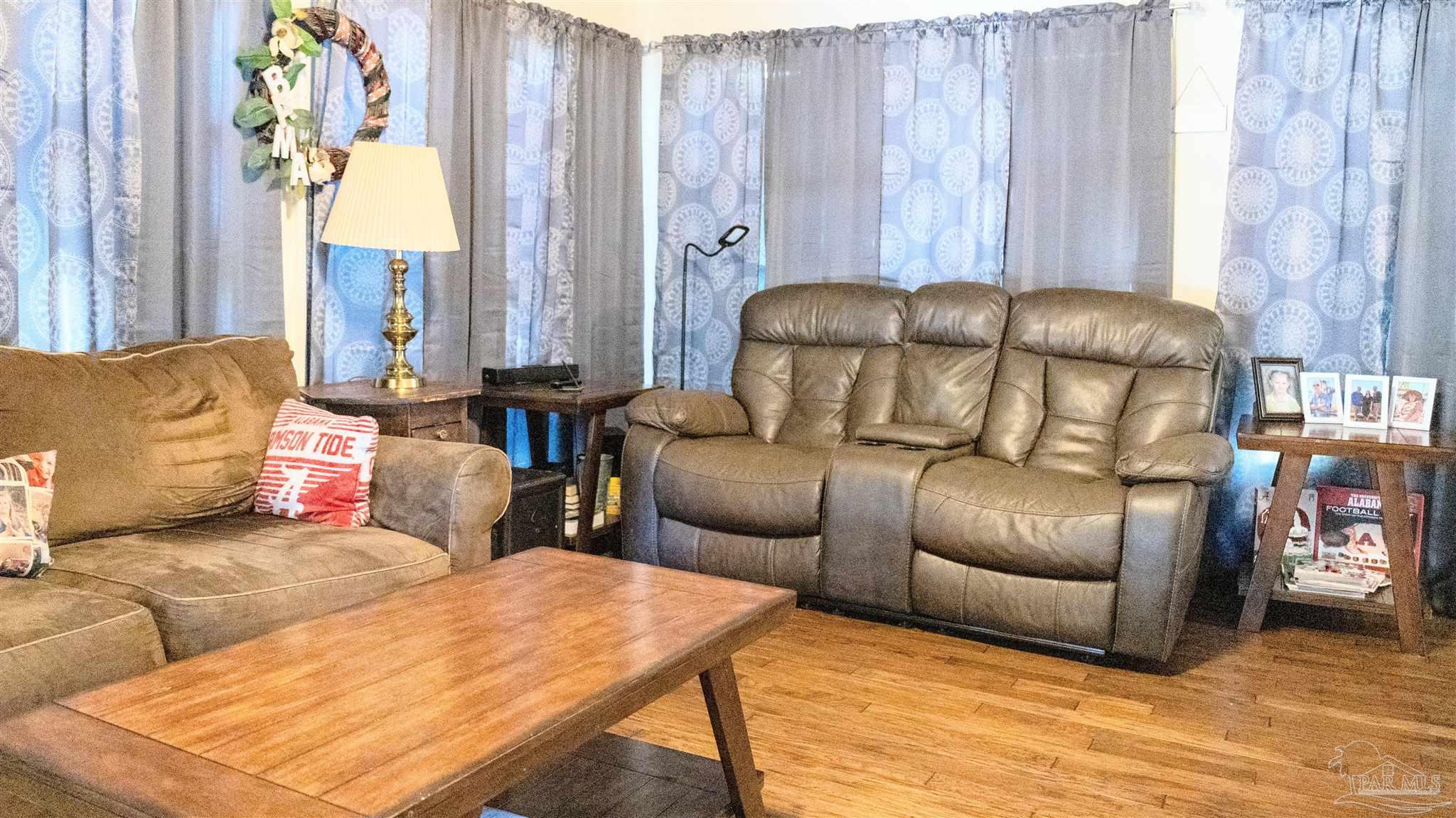 1700 Prospect Road Coffeeville, AL 36524 - Photo 7 of 71 a living room with furniture and a large window