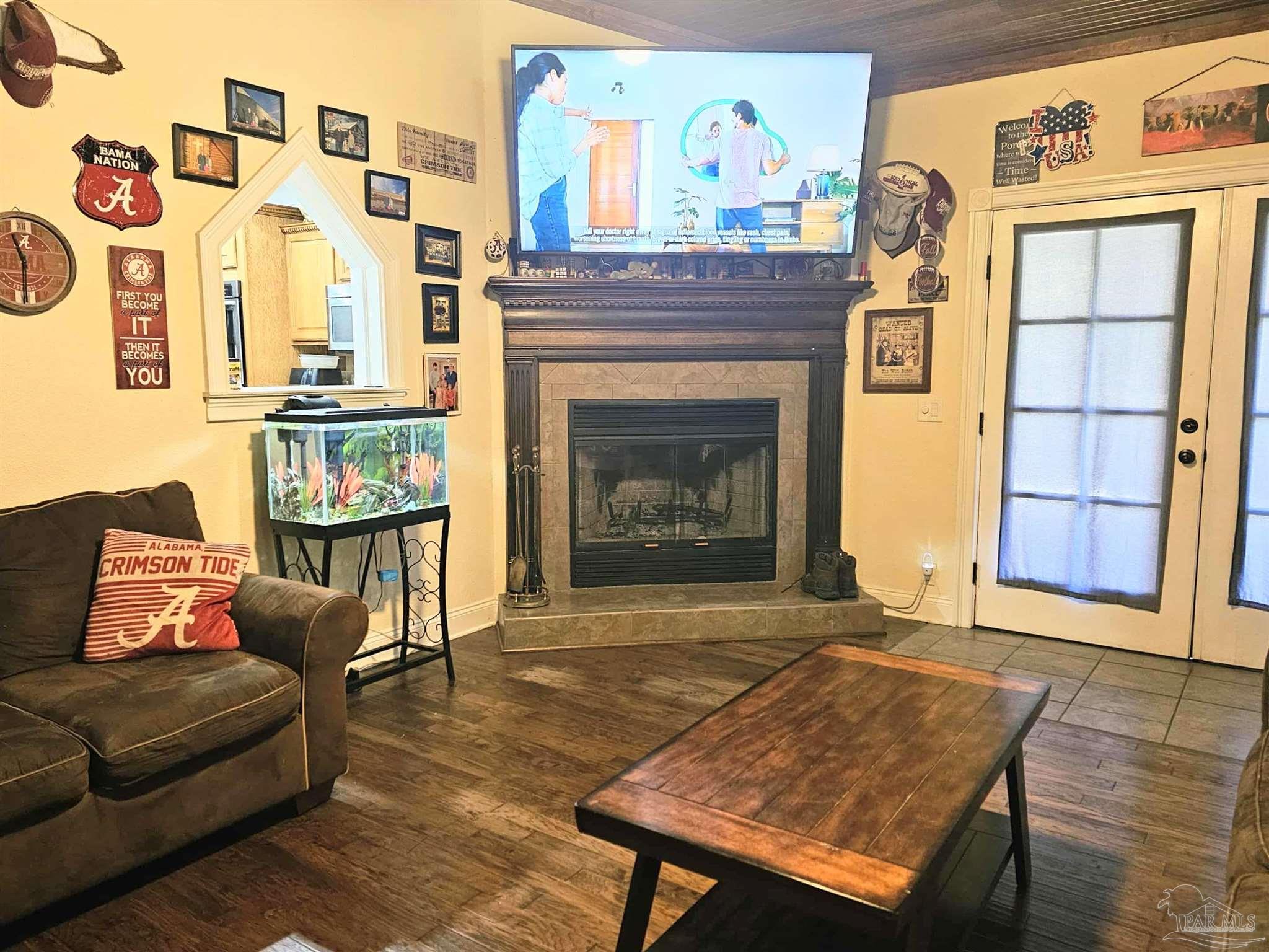 1700 Prospect Road Coffeeville, AL 36524 - Photo 9 of 71 a living room with furniture and a fireplace