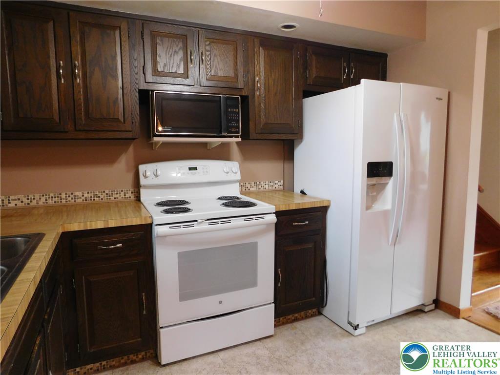 21 Will Barnesville, PA 18214 - Photo 8 of 23 Functional kitchen with warm cabinetry and ample space for culinary endeavors.