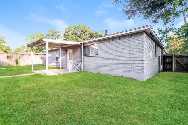 a backyard of a house with lots of green space