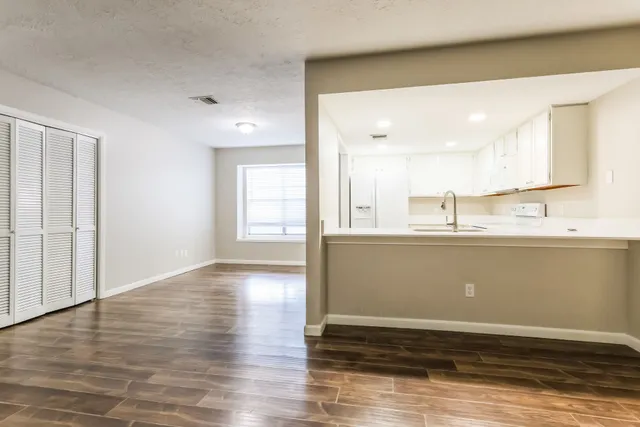 a view of kitchen with wooden floor