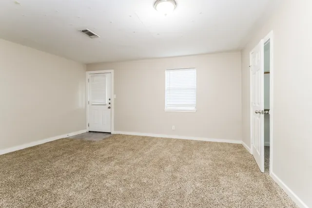 an empty room with windows