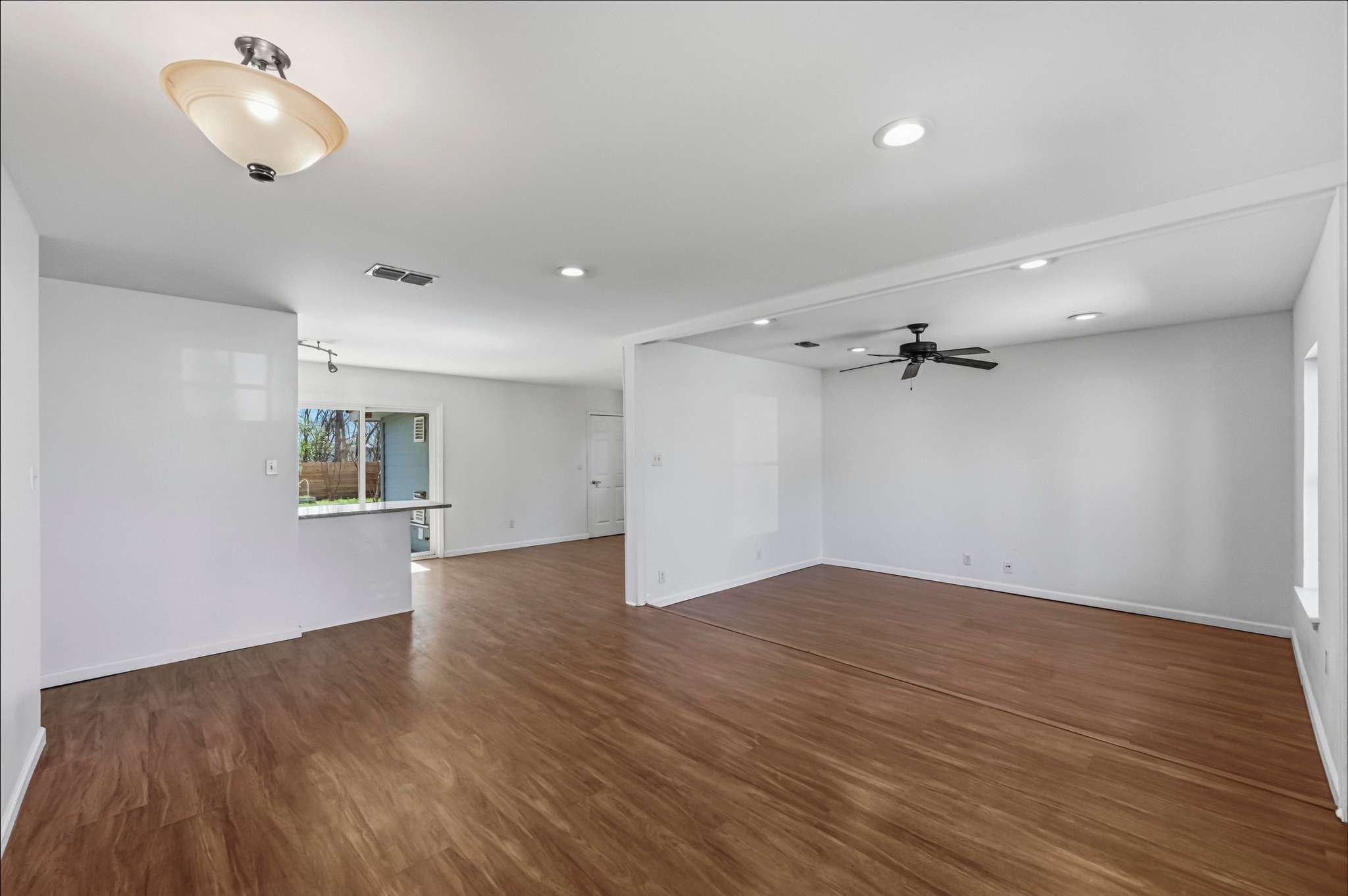 1005 Arthur Stiles Road Austin, TX 78721 - Photo 6 of 29 wood laminate flooring in living area.