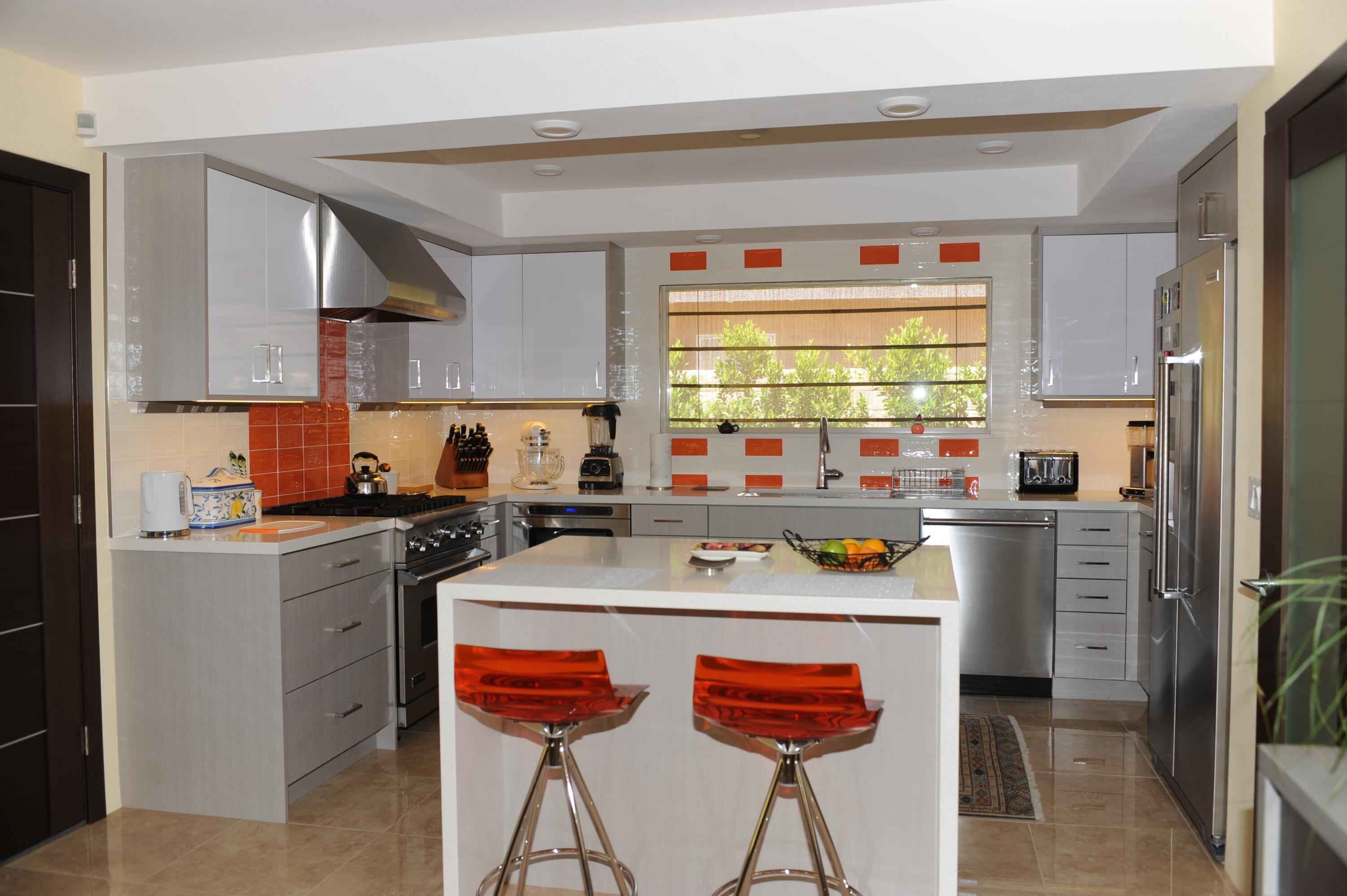 1490 East Racquet Club Road Palm Springs, CA 92262 - Photo 12 of 29 a kitchen with a refrigerator and a stove top oven