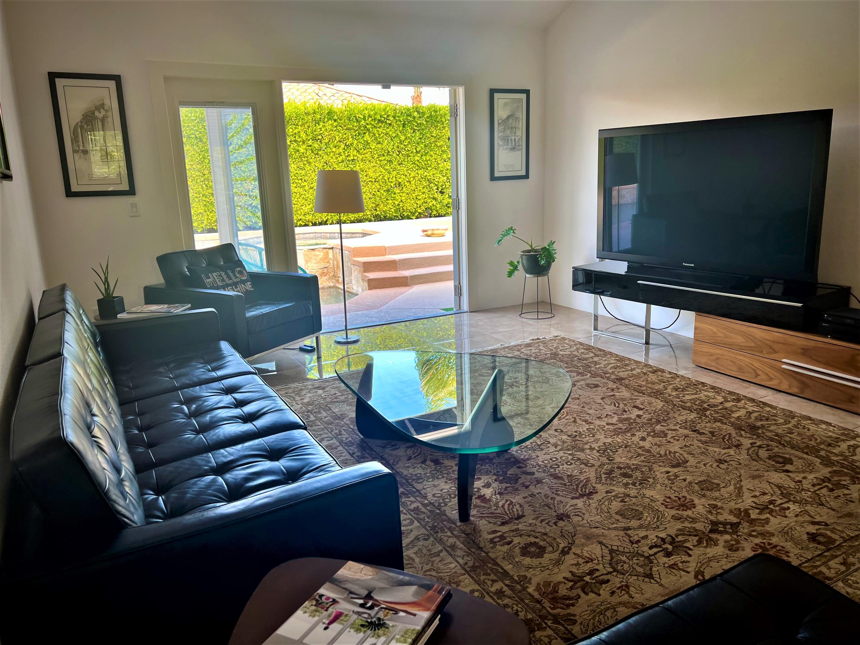 1490 East Racquet Club Road Palm Springs, CA 92262 - Photo 14 of 29 a living room with furniture and a flat screen tv