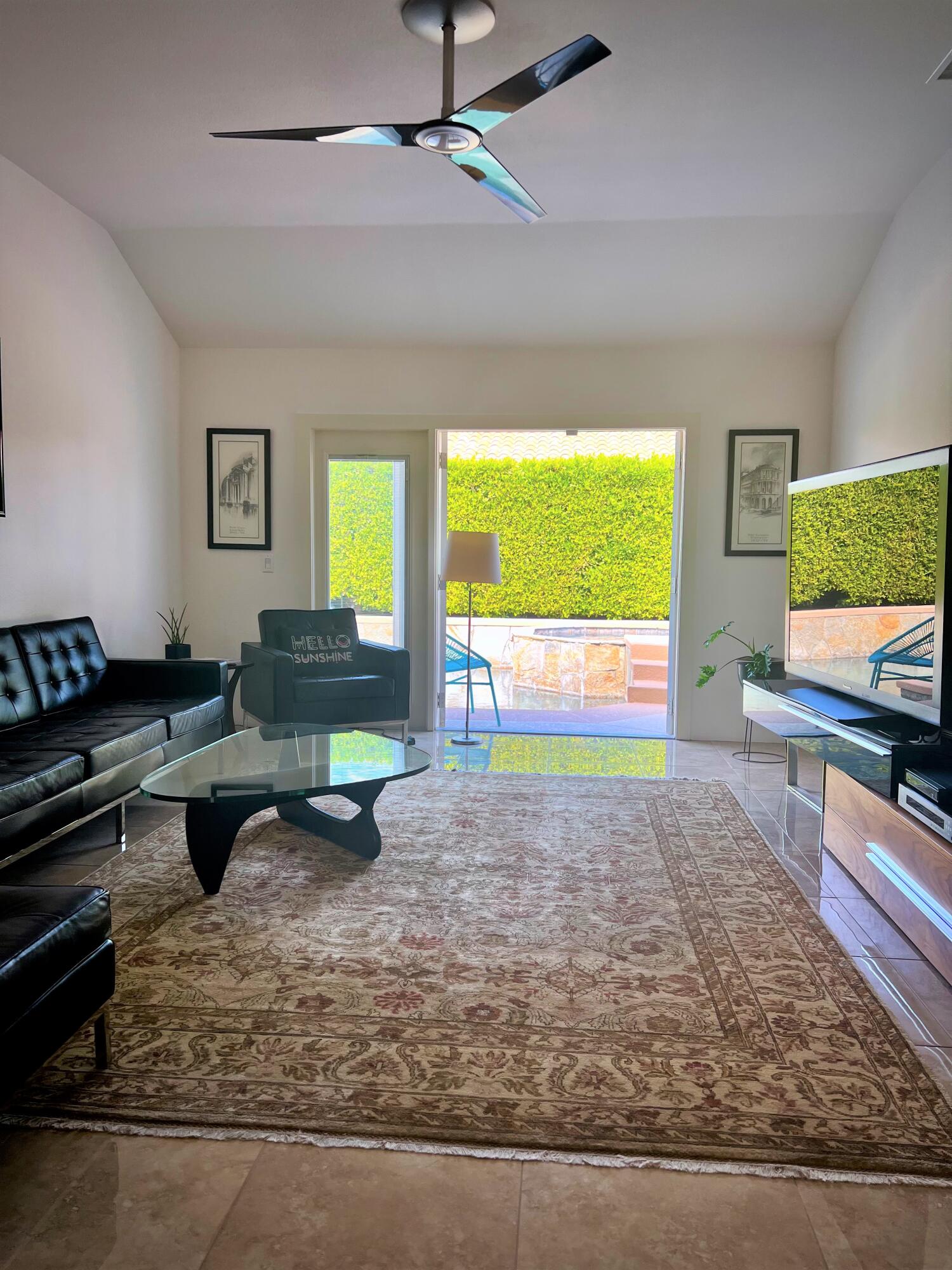 1490 East Racquet Club Road Palm Springs, CA 92262 - Photo 15 of 29 a living room with furniture and a flat screen tv