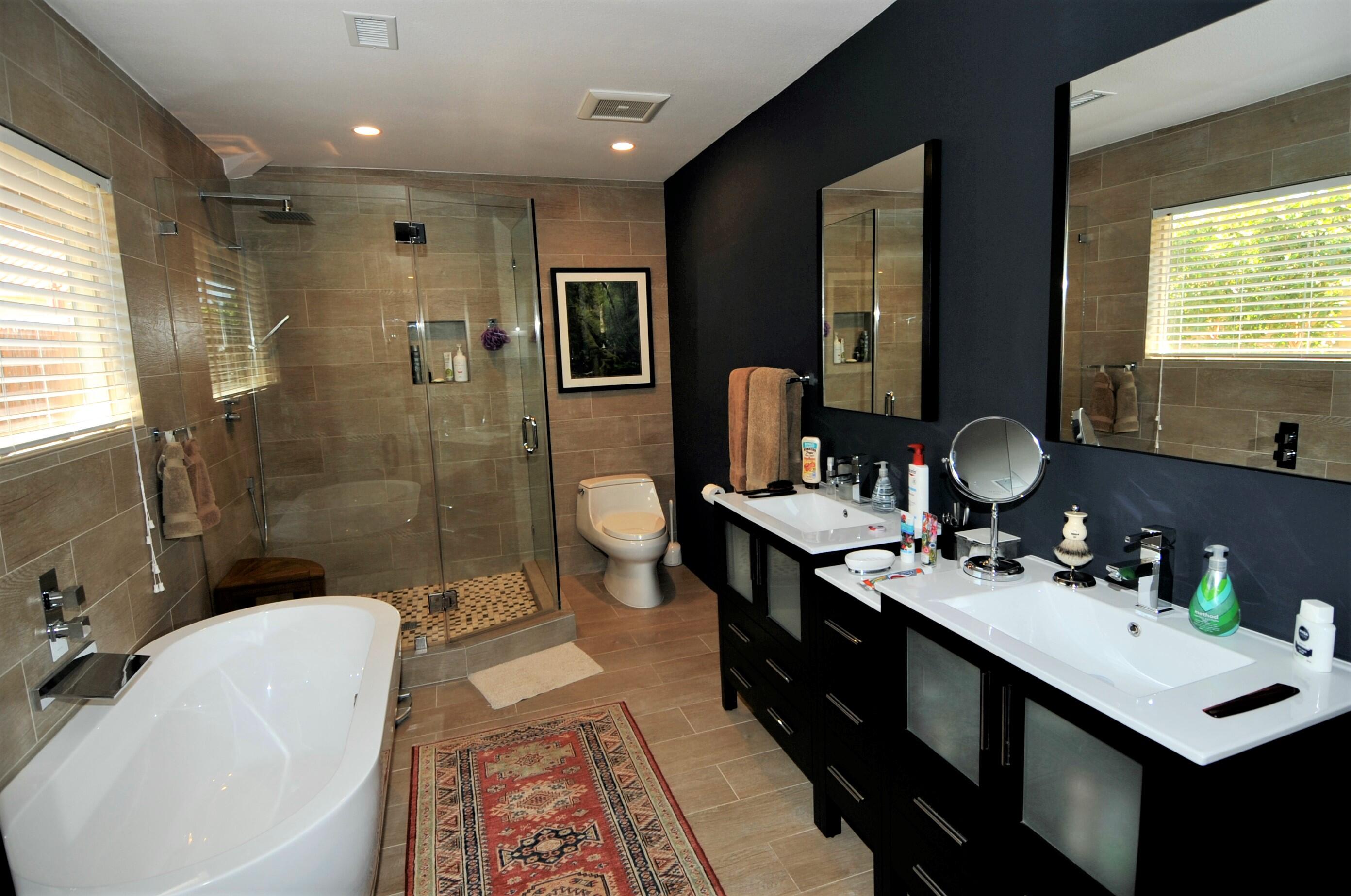 1490 East Racquet Club Road Palm Springs, CA 92262 - Photo 19 of 29 a bathroom with a double vanity sink toilet mirror and shower