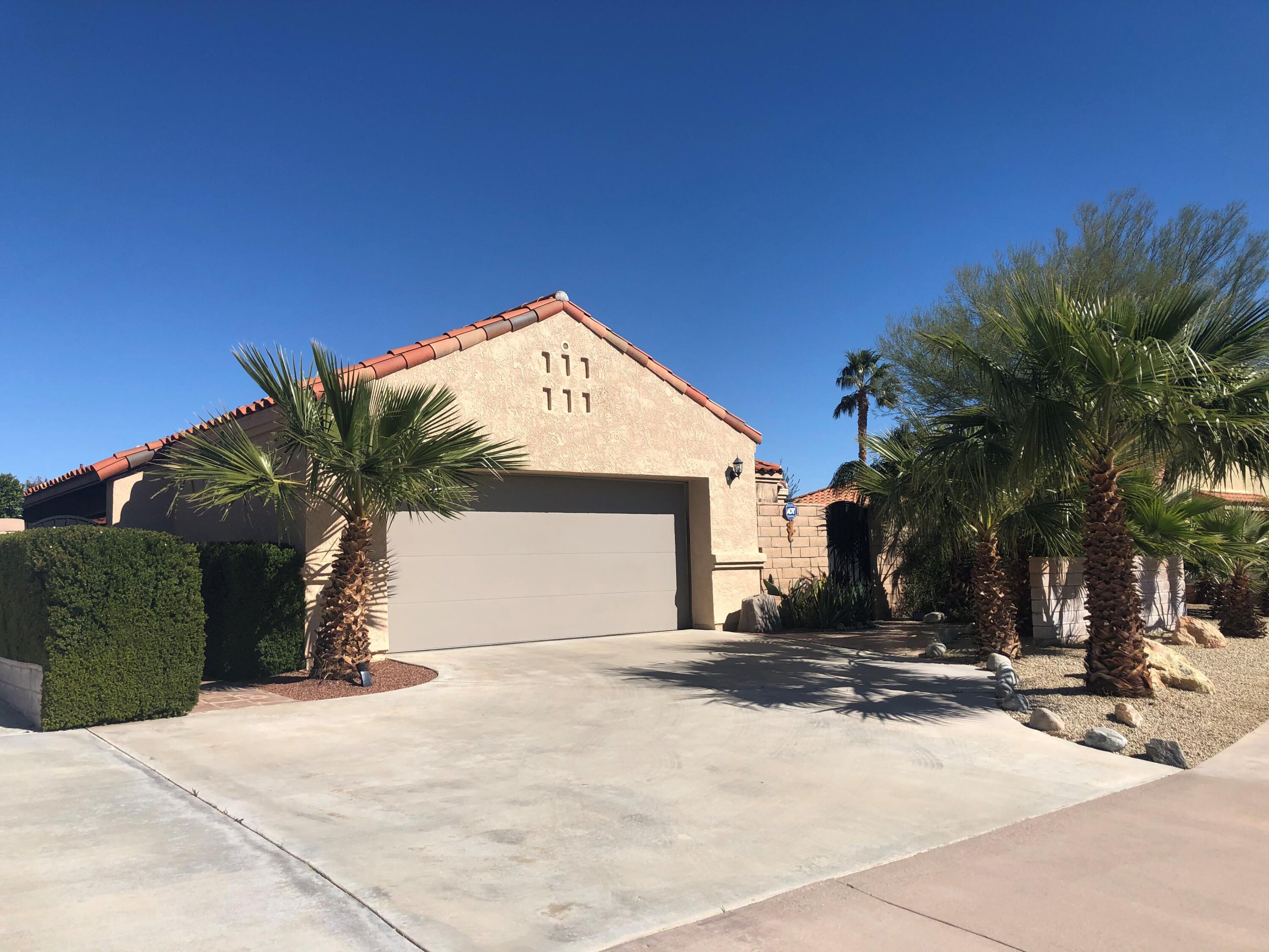 1490 East Racquet Club Road Palm Springs, CA 92262 - Photo 2 of 29 a view of a house with a yard