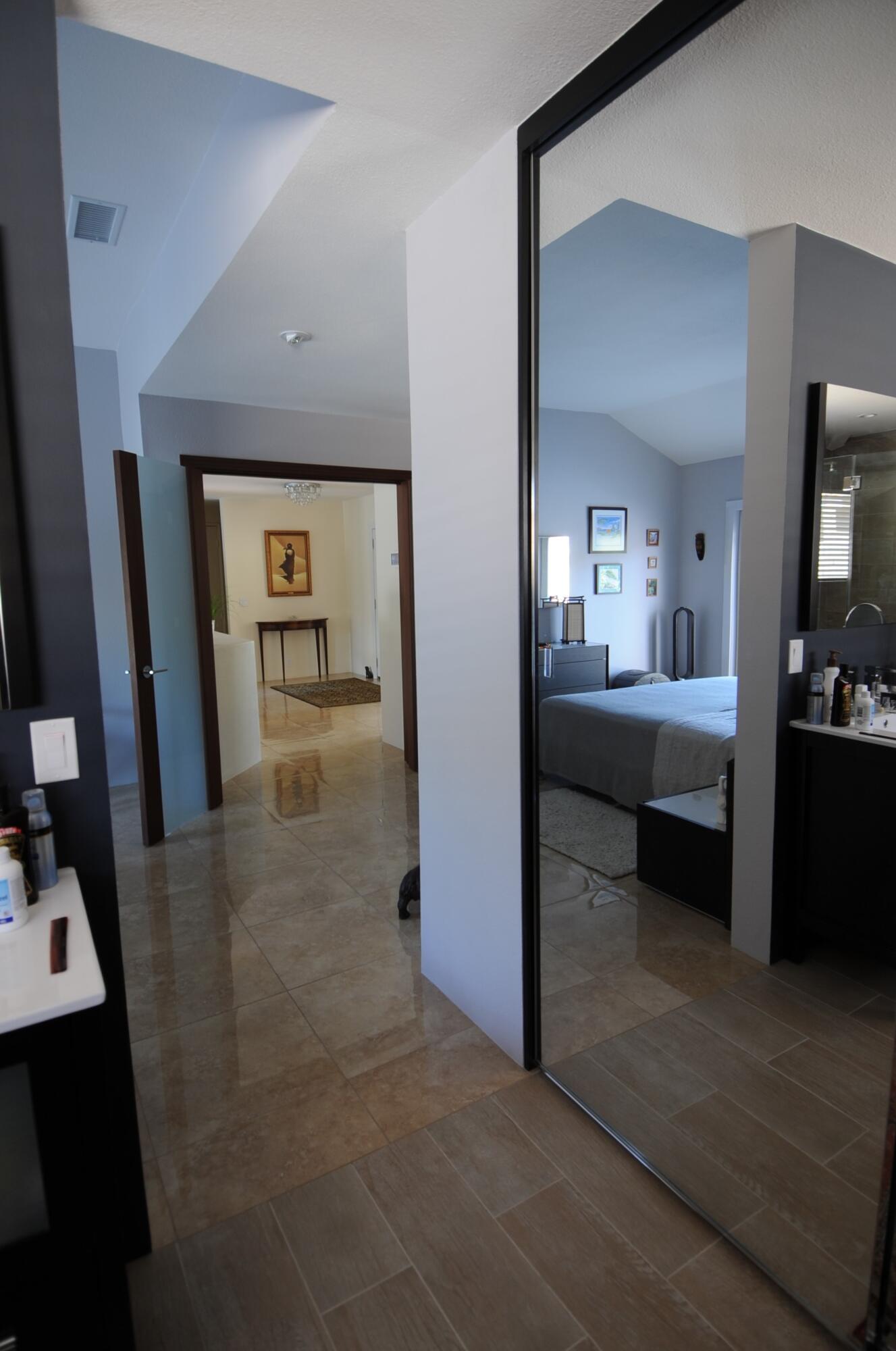 1490 East Racquet Club Road Palm Springs, CA 92262 - Photo 21 of 29 a view of a bedroom from a hallway