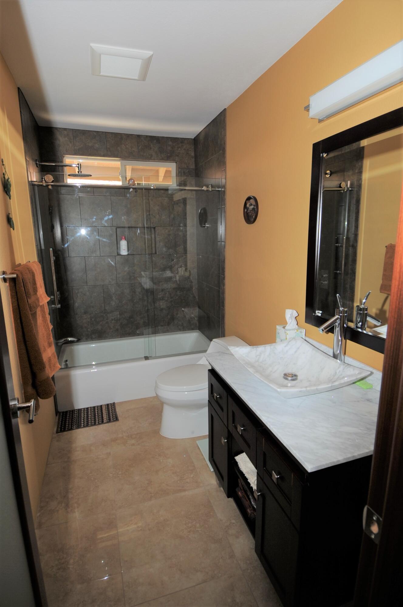 1490 East Racquet Club Road Palm Springs, CA 92262 - Photo 23 of 29 a bathroom with a sink and a mirror