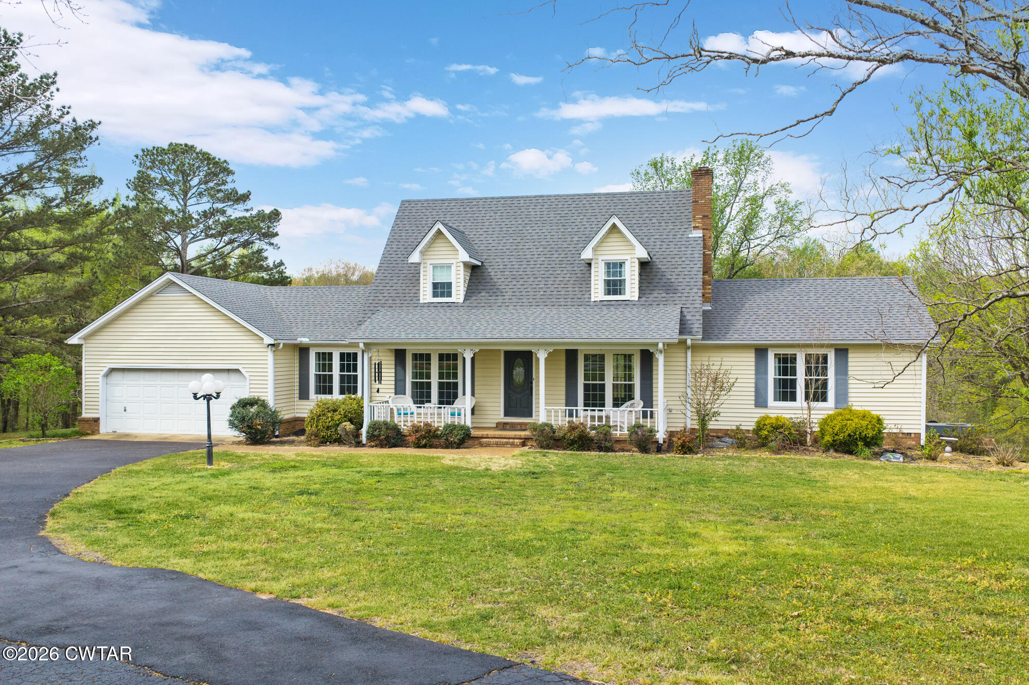 741 Independence Loop Lexington, TN 38351 - Photo 1 of 30 a front view of a house with a garden