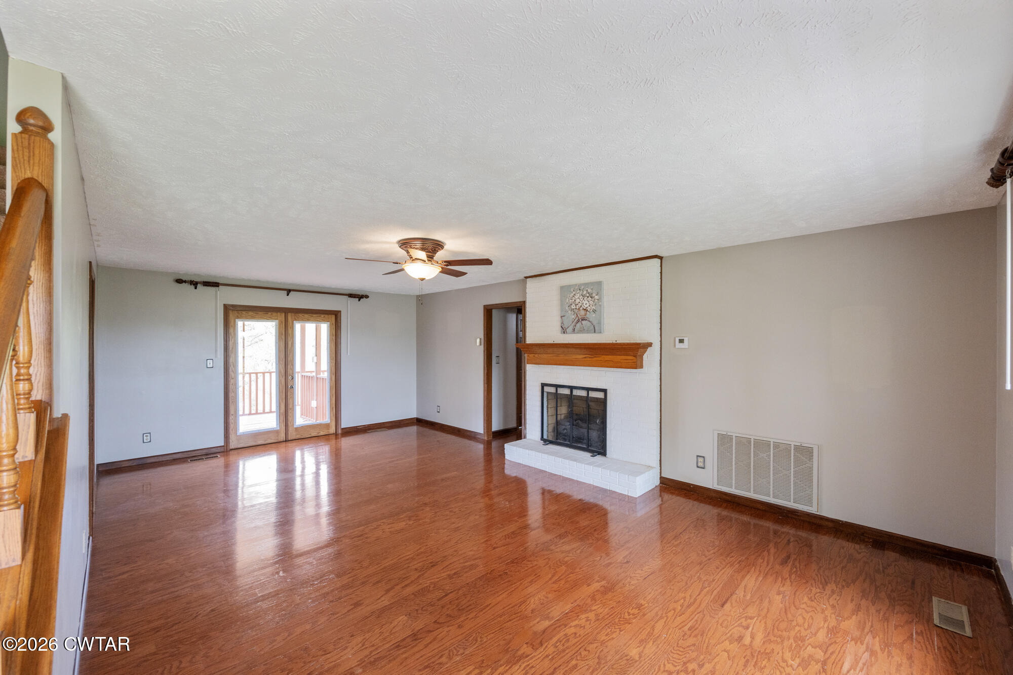 741 Independence Loop Lexington, TN 38351 - Photo 12 of 30 a view of an empty room with a fireplace and a window