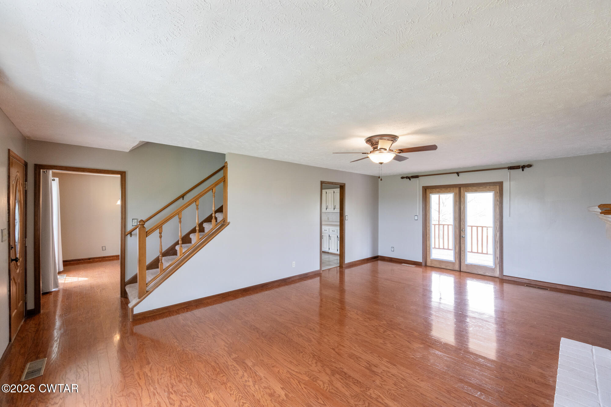 741 Independence Loop Lexington, TN 38351 - Photo 13 of 30 wooden floor in an empty room with a window