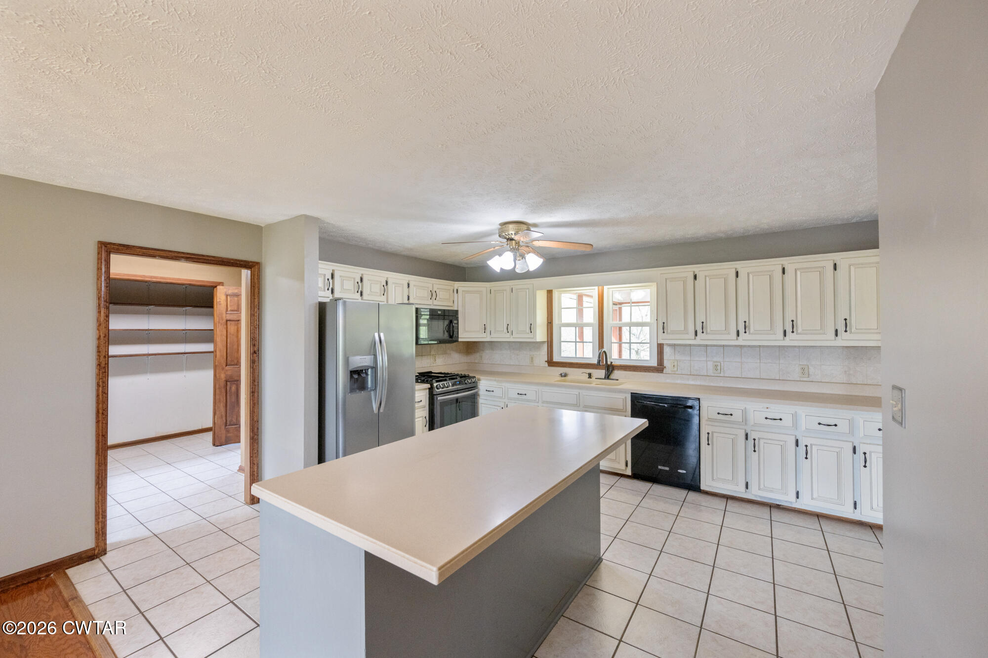 741 Independence Loop Lexington, TN 38351 - Photo 15 of 30 a large kitchen with cabinets and stainless steel appliances