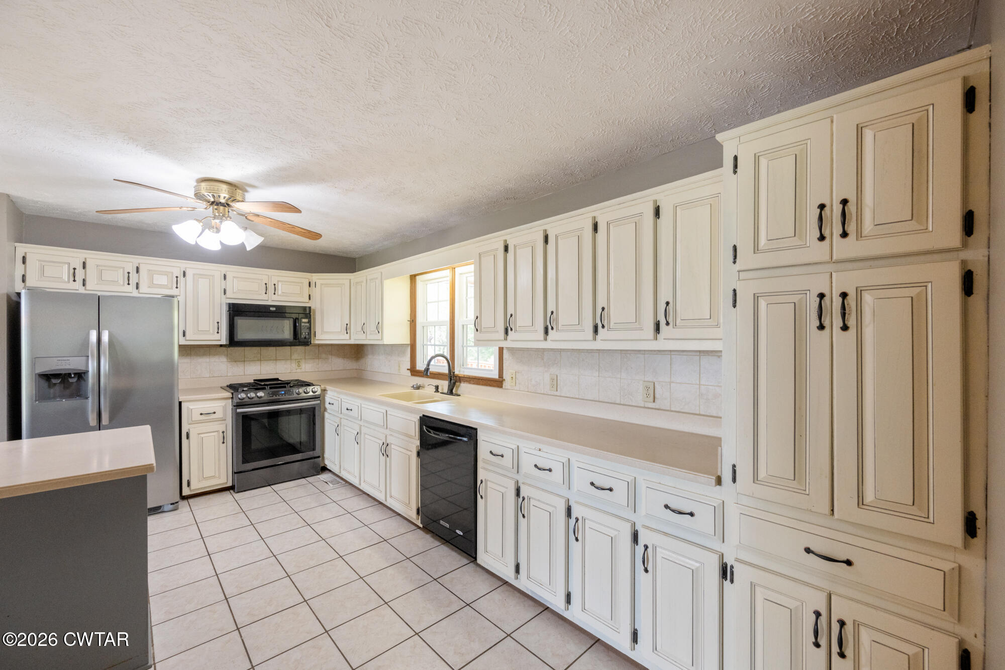 741 Independence Loop Lexington, TN 38351 - Photo 16 of 30 a large kitchen with cabinets and stainless steel appliances