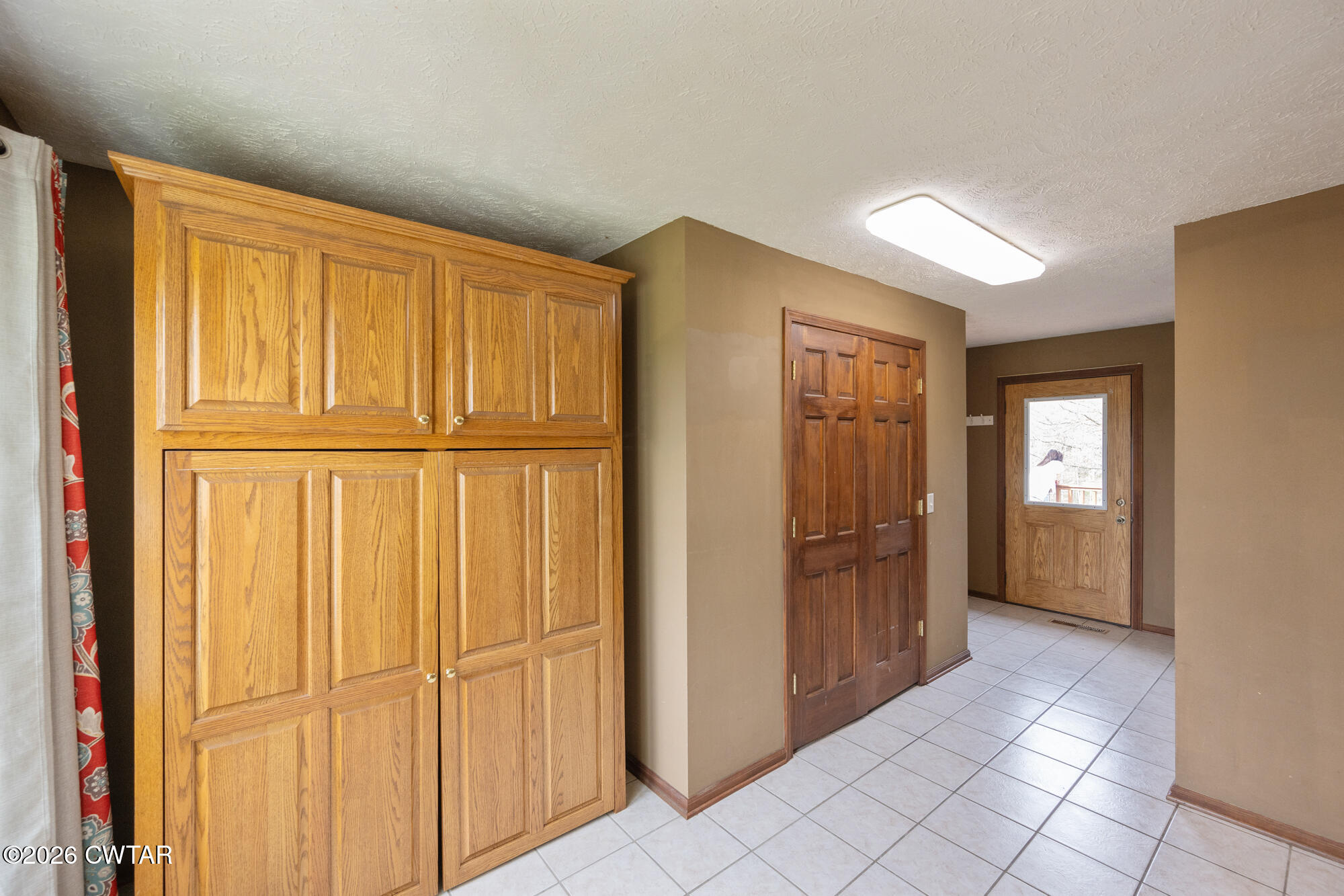 741 Independence Loop Lexington, TN 38351 - Photo 17 of 30 a view of a hallway with wooden floor and cabinet