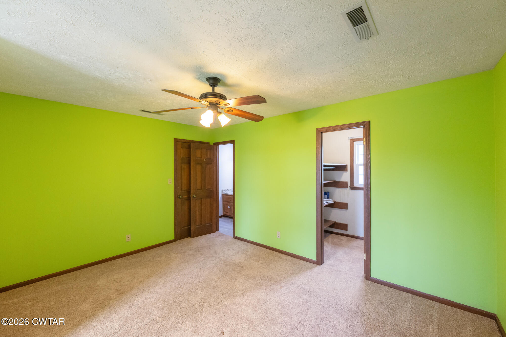 741 Independence Loop Lexington, TN 38351 - Photo 25 of 30 wooden floor in an empty room with a window