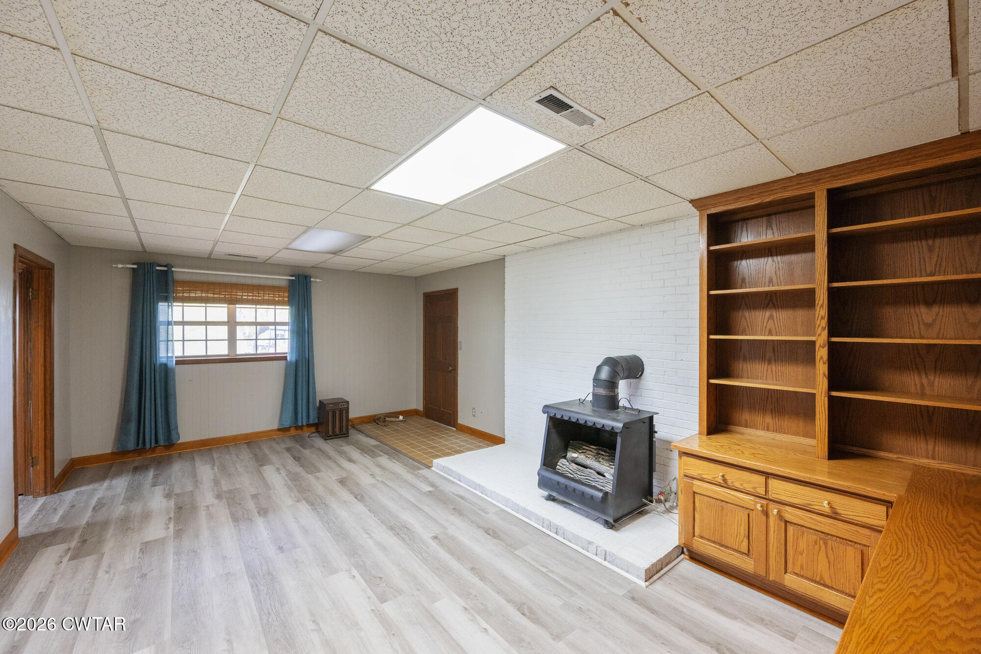 741 Independence Loop Lexington, TN 38351 - Photo 27 of 30 a room with furniture and a wooden floor