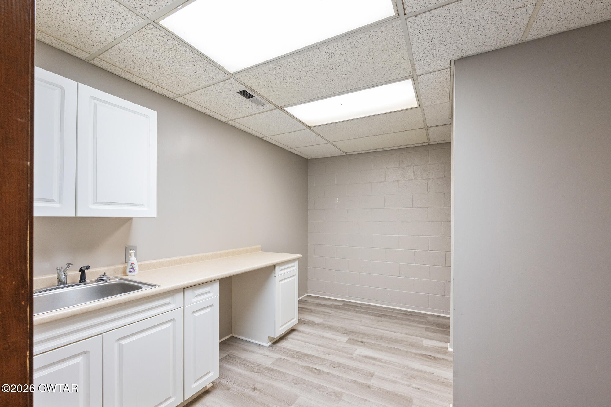 741 Independence Loop Lexington, TN 38351 - Photo 29 of 30 a room with a sink cabinets and utility