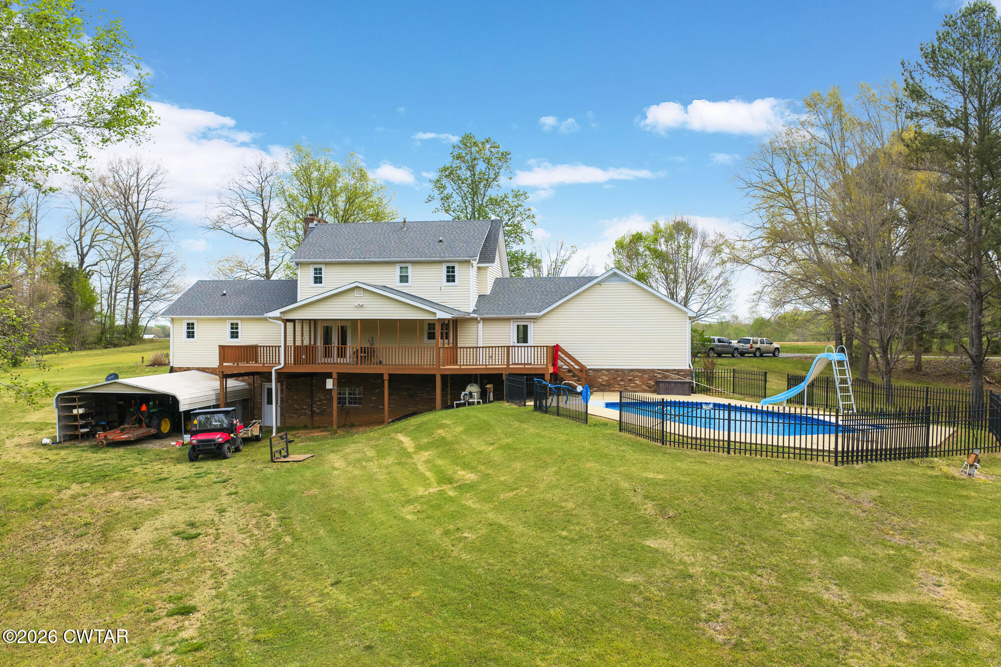 741 Independence Loop Lexington, TN 38351 - Photo 5 of 30 a view of a house with swimming pool and sitting area