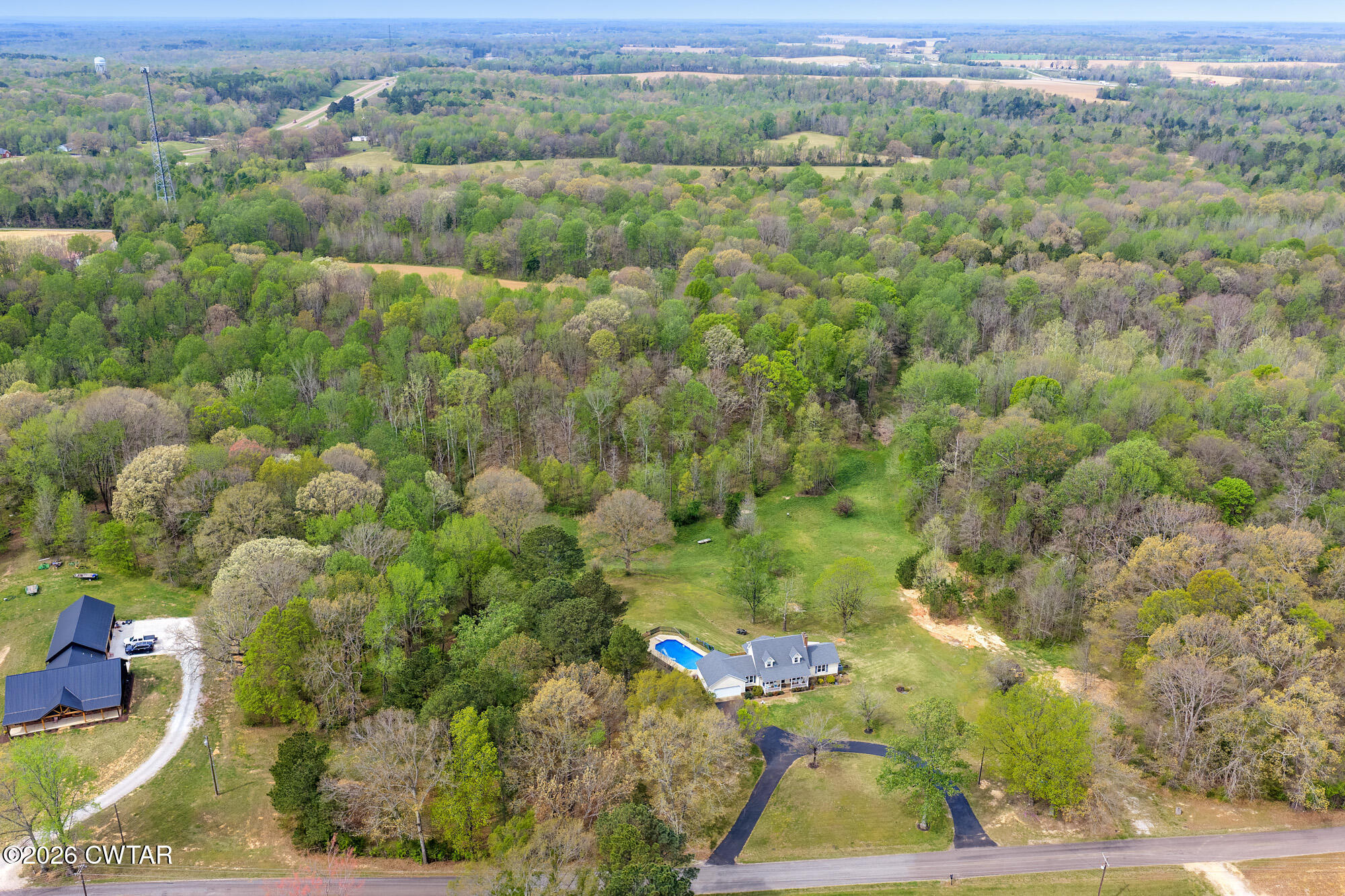 741 Independence Loop Lexington, TN 38351 - Photo 9 of 30 an aerial view of a residential houses with outdoor space and trees