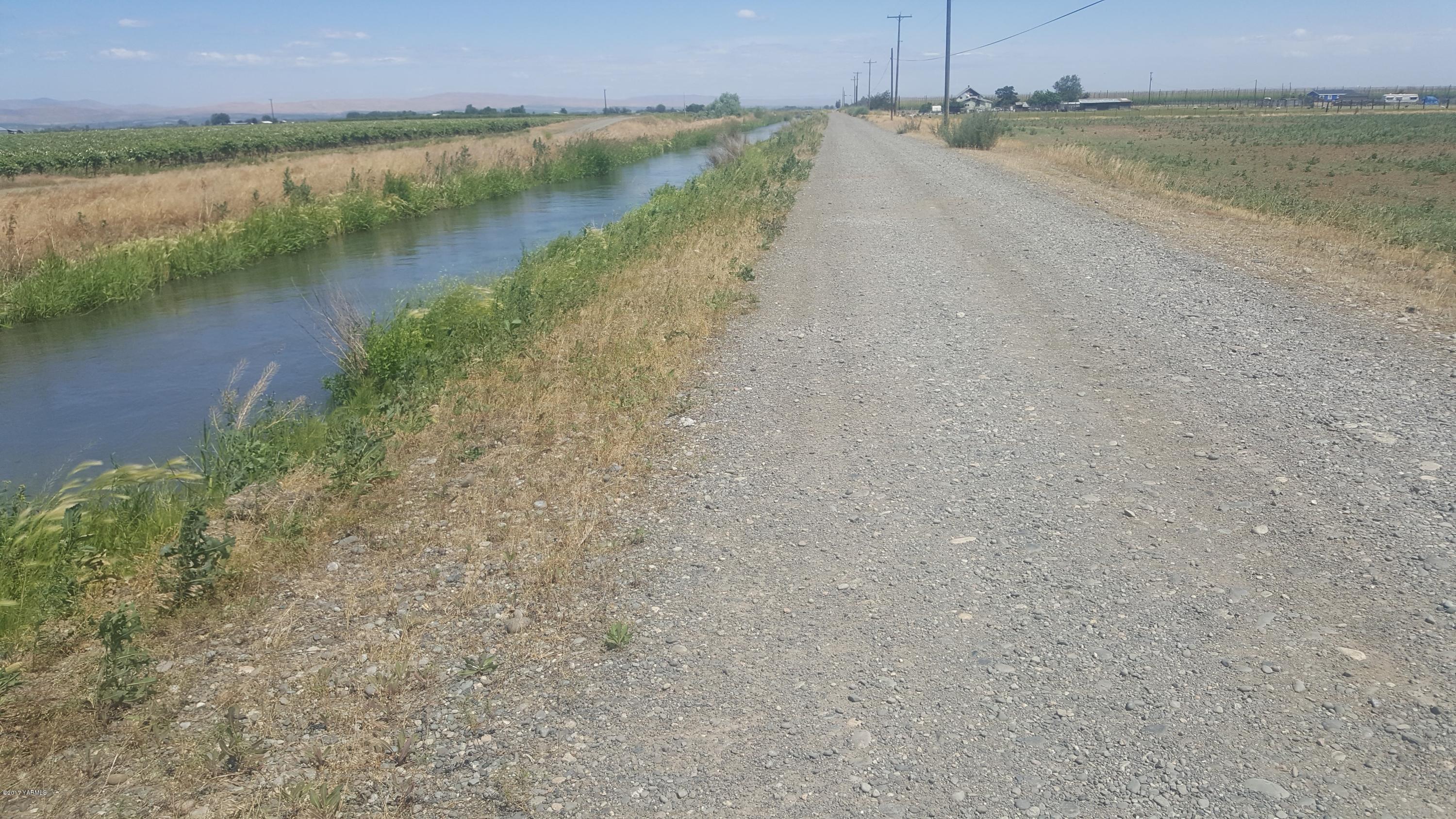 6530 Ashue Road Wapato, WA 98951 - Photo 12 of 14 a view of a lake view with a beach