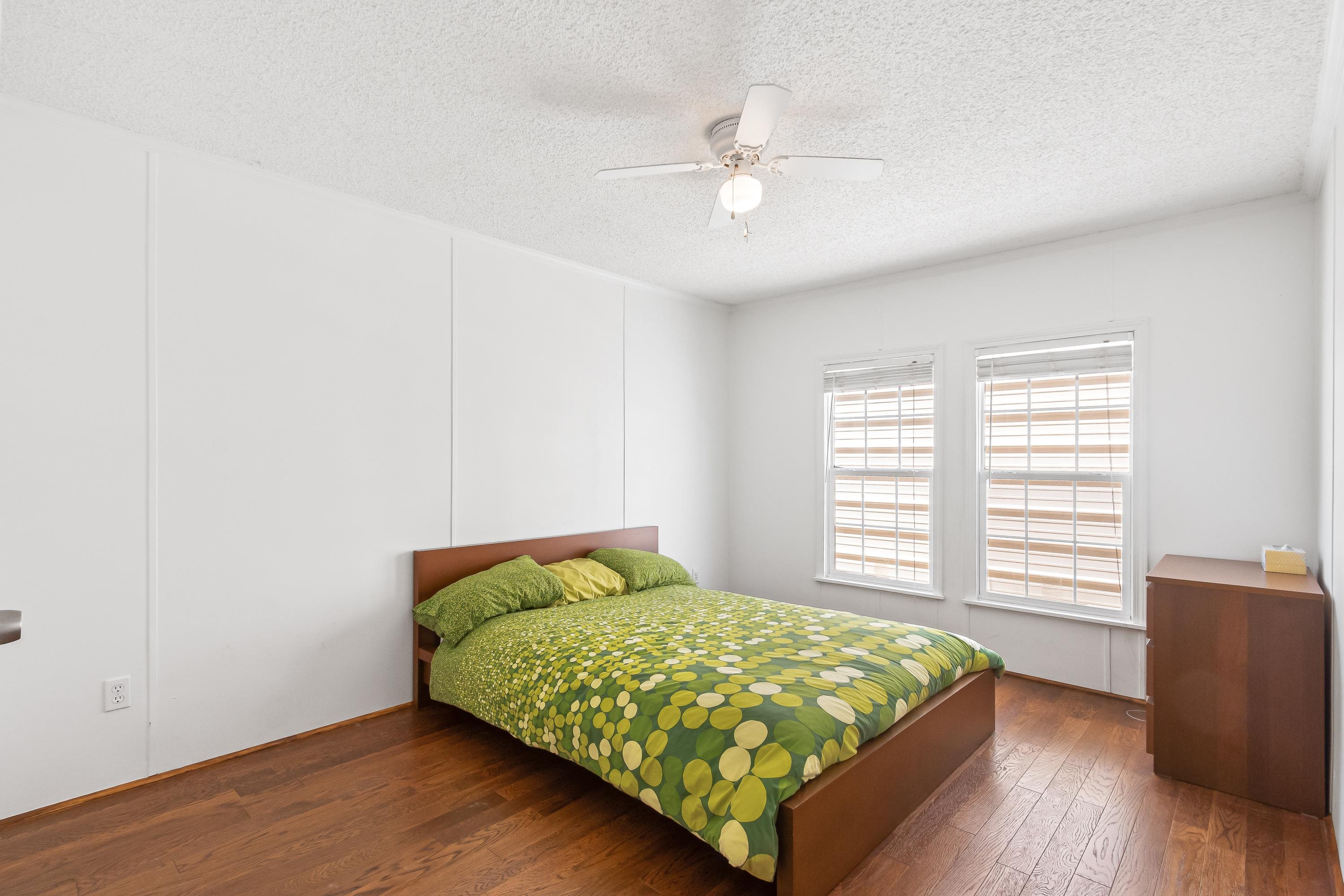 205 Treasure Beach Road St. Augustine, FL 32080 - Photo 21 of 43 a bed sitting in a bedroom next to a window