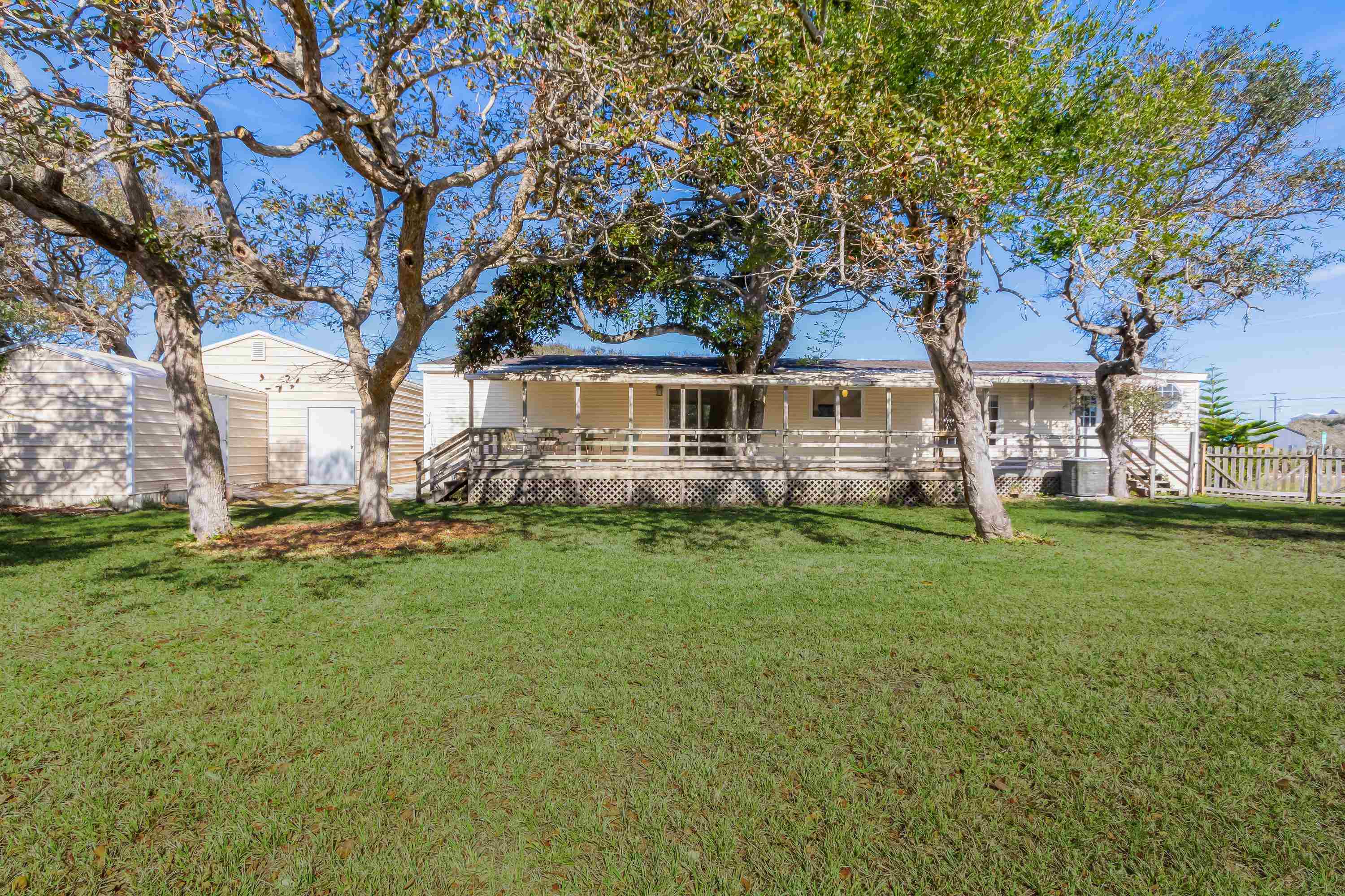 205 Treasure Beach Road St. Augustine, FL 32080 - Photo 31 of 43 a front view of house with yard
