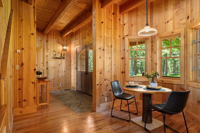 a dining room with furniture and window