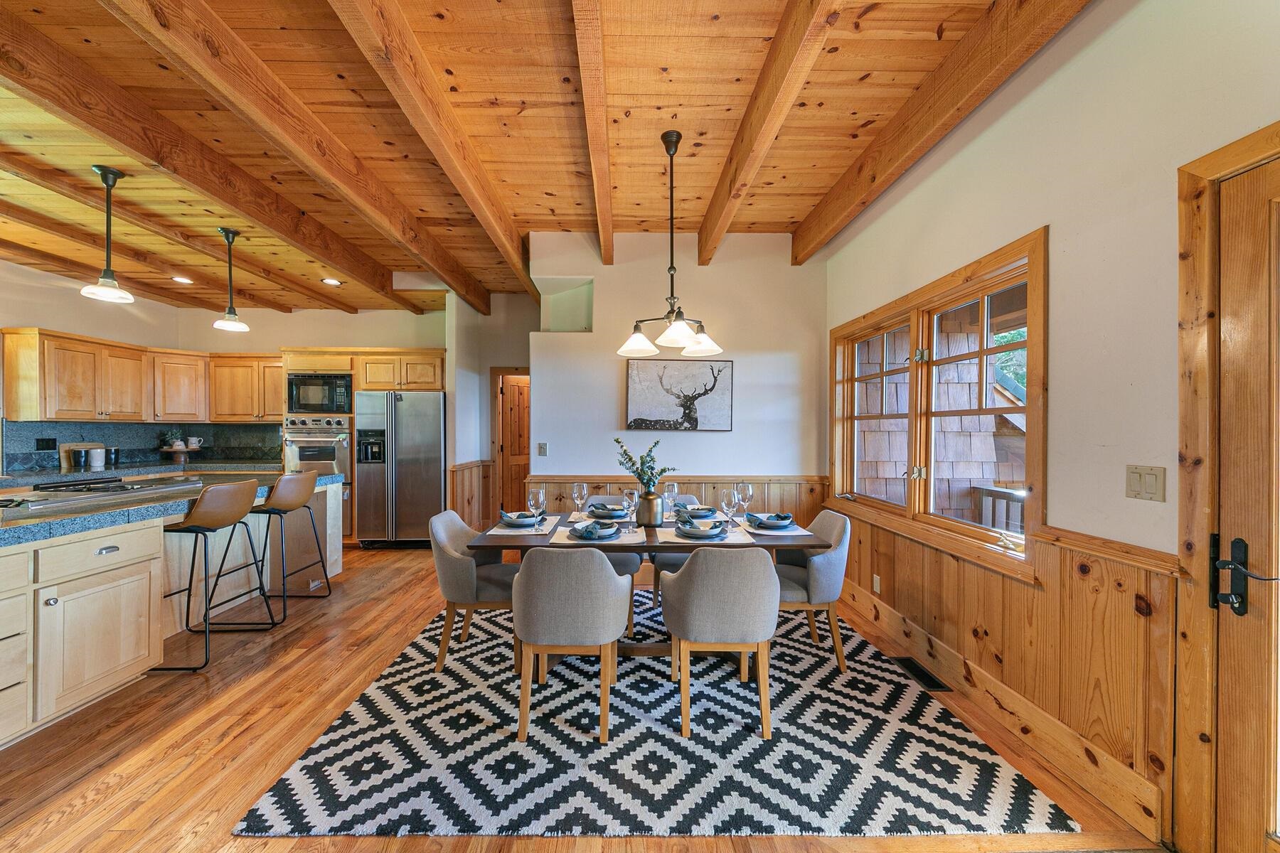 18168 La Mirada Road Truckee, CA 96161 - Photo 12 of 28 a view of a dining room with furniture window and wooden floor