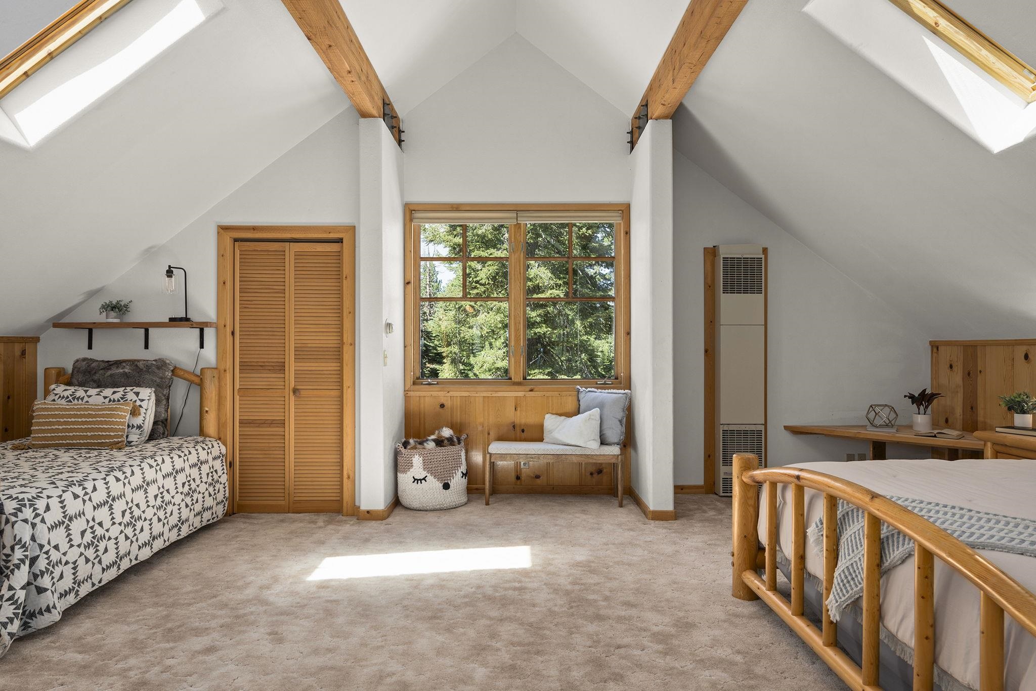 18168 La Mirada Road Truckee, CA 96161 - Photo 18 of 28 a bedroom with furniture and a large window