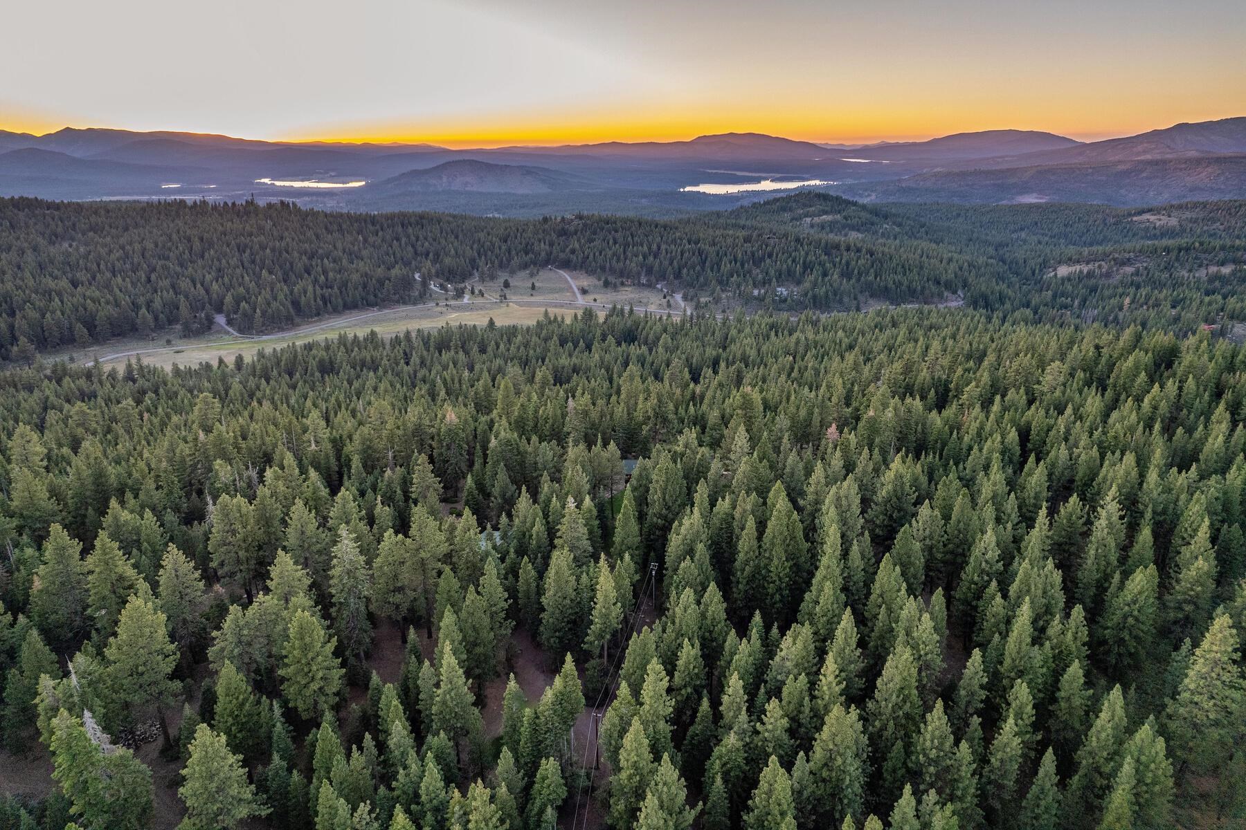 18168 La Mirada Road Truckee, CA 96161 - Photo 24 of 28 a view of a lush green hillside and a building