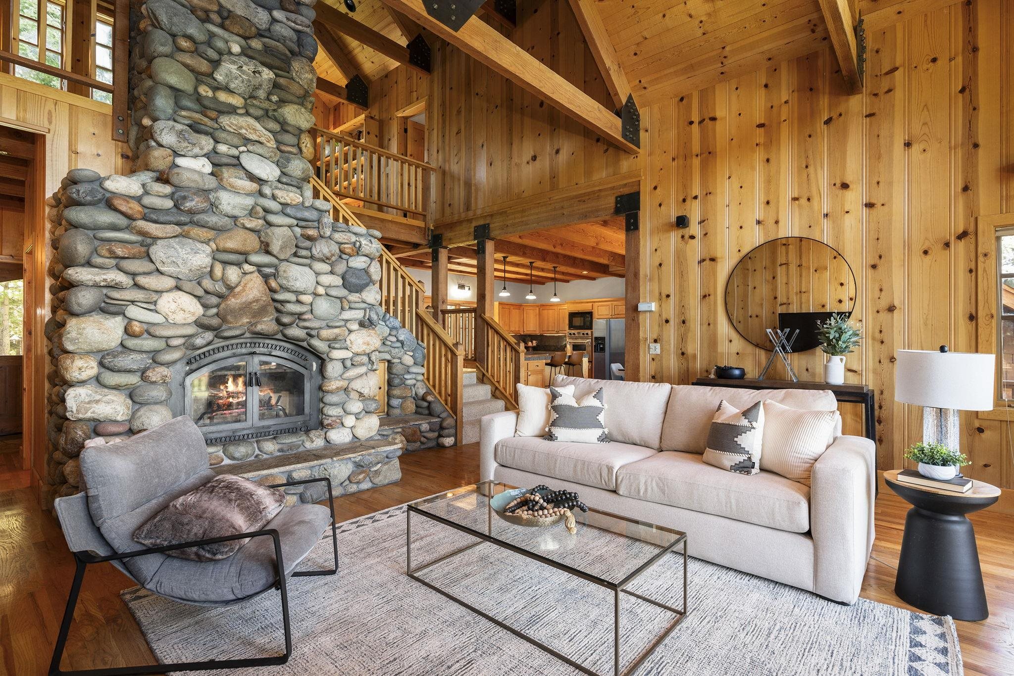 18168 La Mirada Road Truckee, CA 96161 - Photo 7 of 28 a living room with furniture a fireplace and walls
