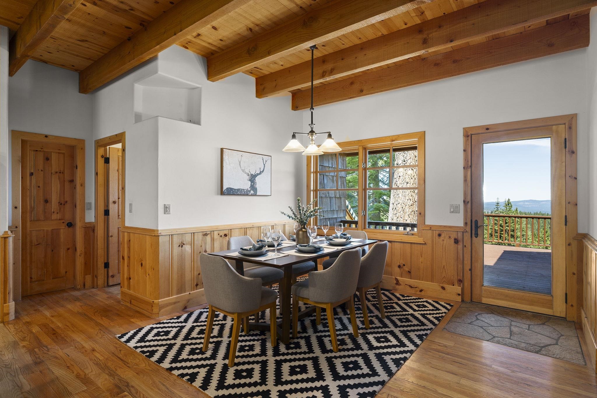 18168 La Mirada Road Truckee, CA 96161 - Photo 10 of 28 a dining room with furniture wooden floor and a chandelier