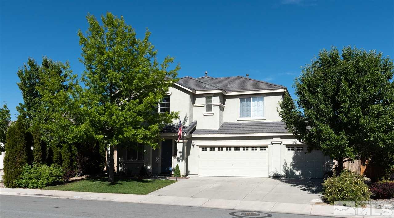 2480 Baton Drive Reno, NV 89521 - Photo 1 of 15 a front view of a house with a yard and garage